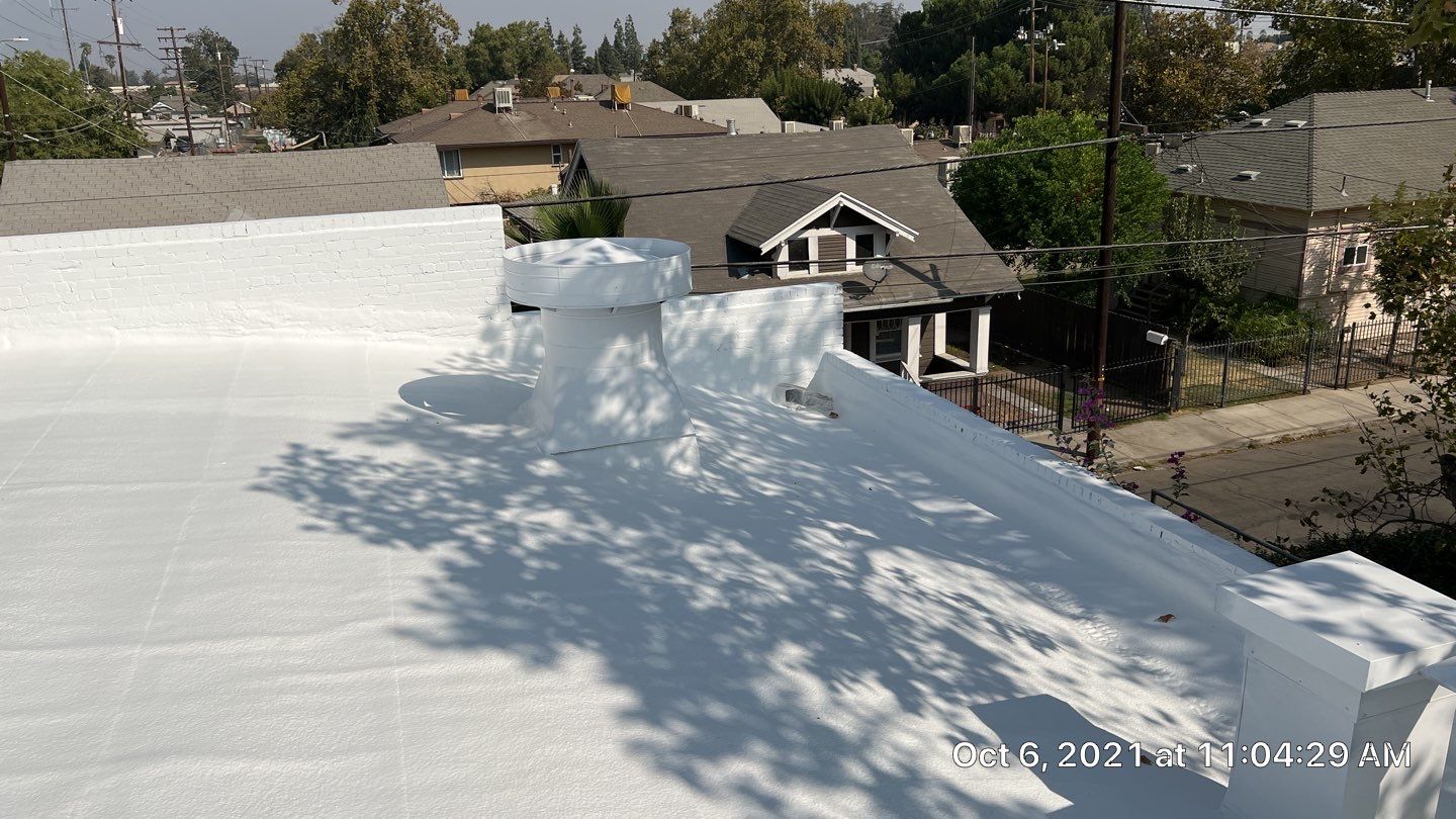 Polyurethane foam roof refurbish and recoating by Straight Edge Roofing Inc