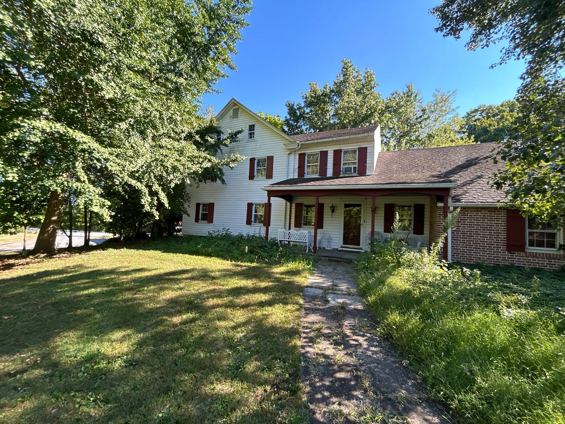 Red Metal Roofing Installation and Trim Restoration in Bernville by Esh Builders