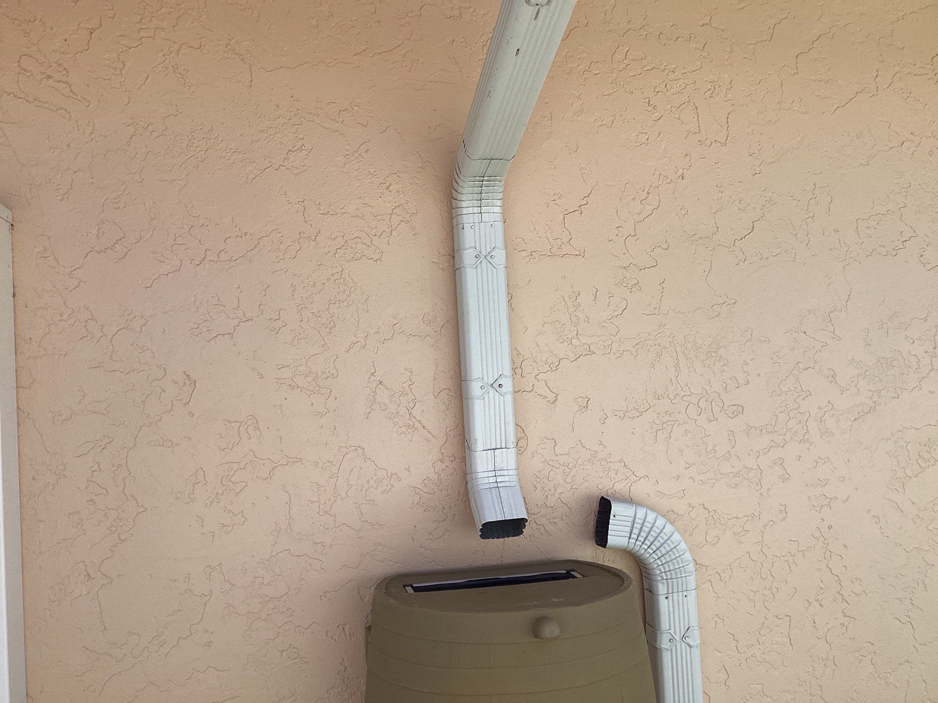 White K Style Seamless Gutters using 3X4 Elbow Downspout in Cape Coral FL by Gutter Professors