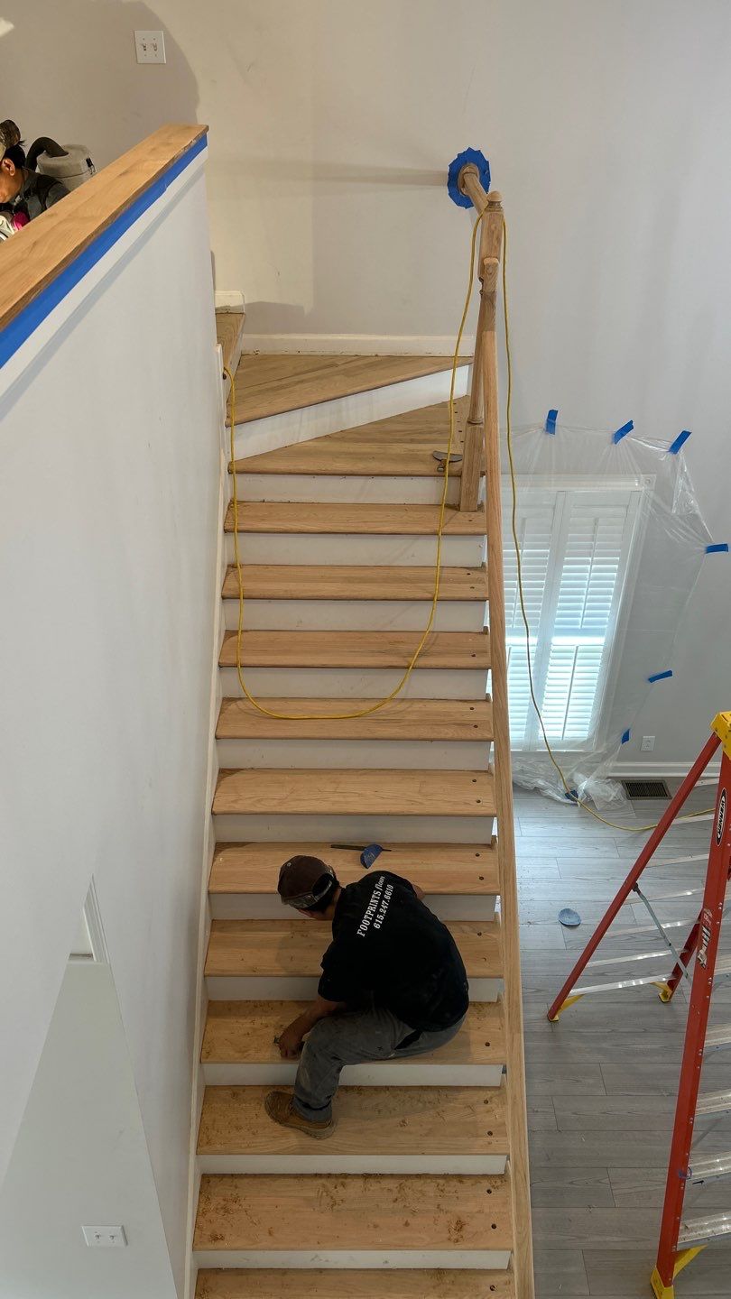 Updated staircase and hallway by Footprints Floors of Nashville