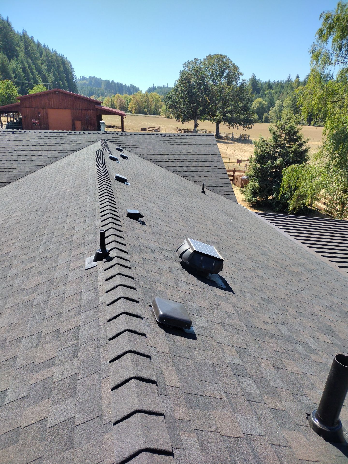 Residential Roof Replacement with Metal Accents by Orezona Building & Roofing Company, Inc.