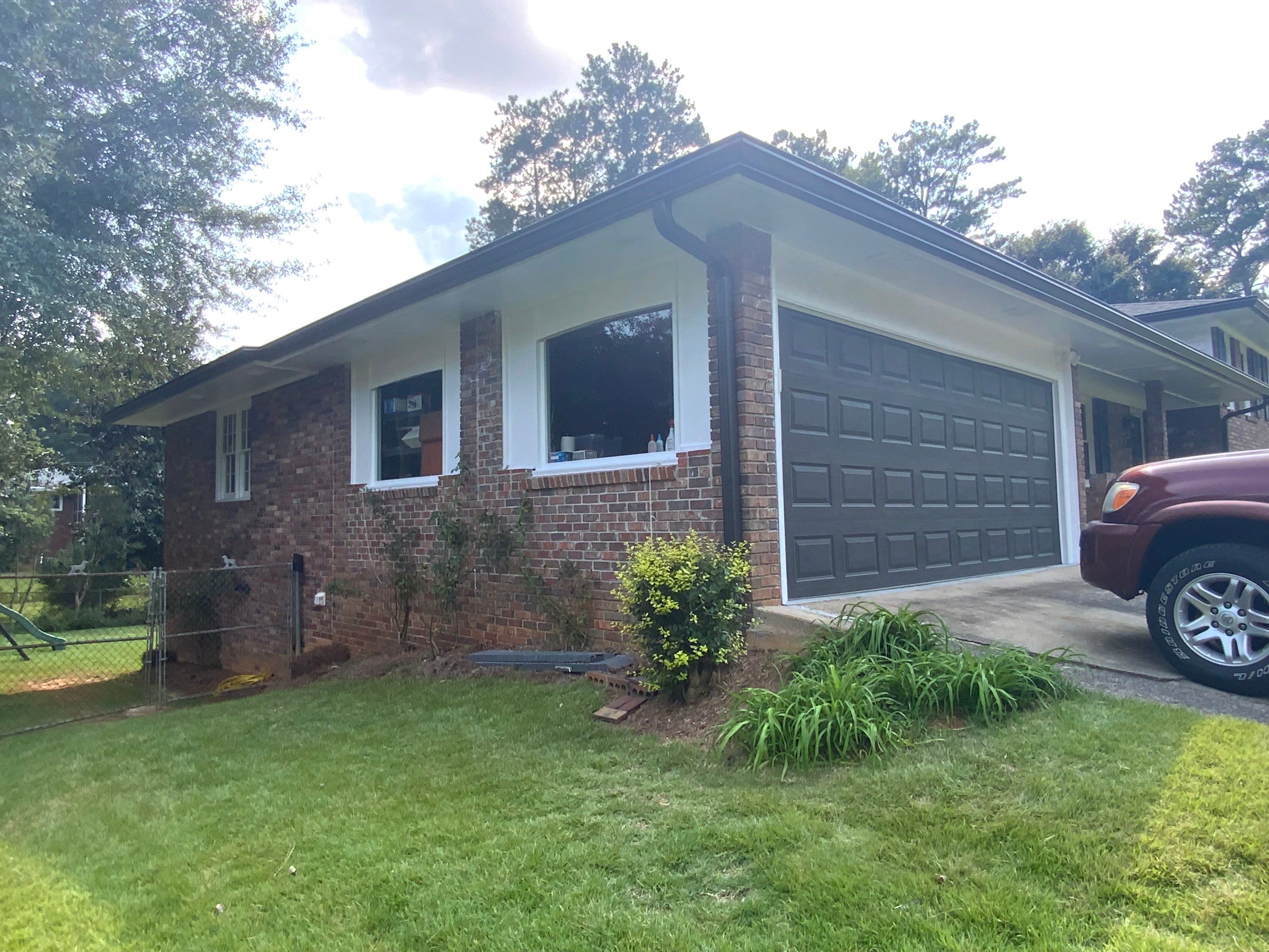Full Exterior Trim Painting and Multi-Level Deck Staining by Swift Home Renovations