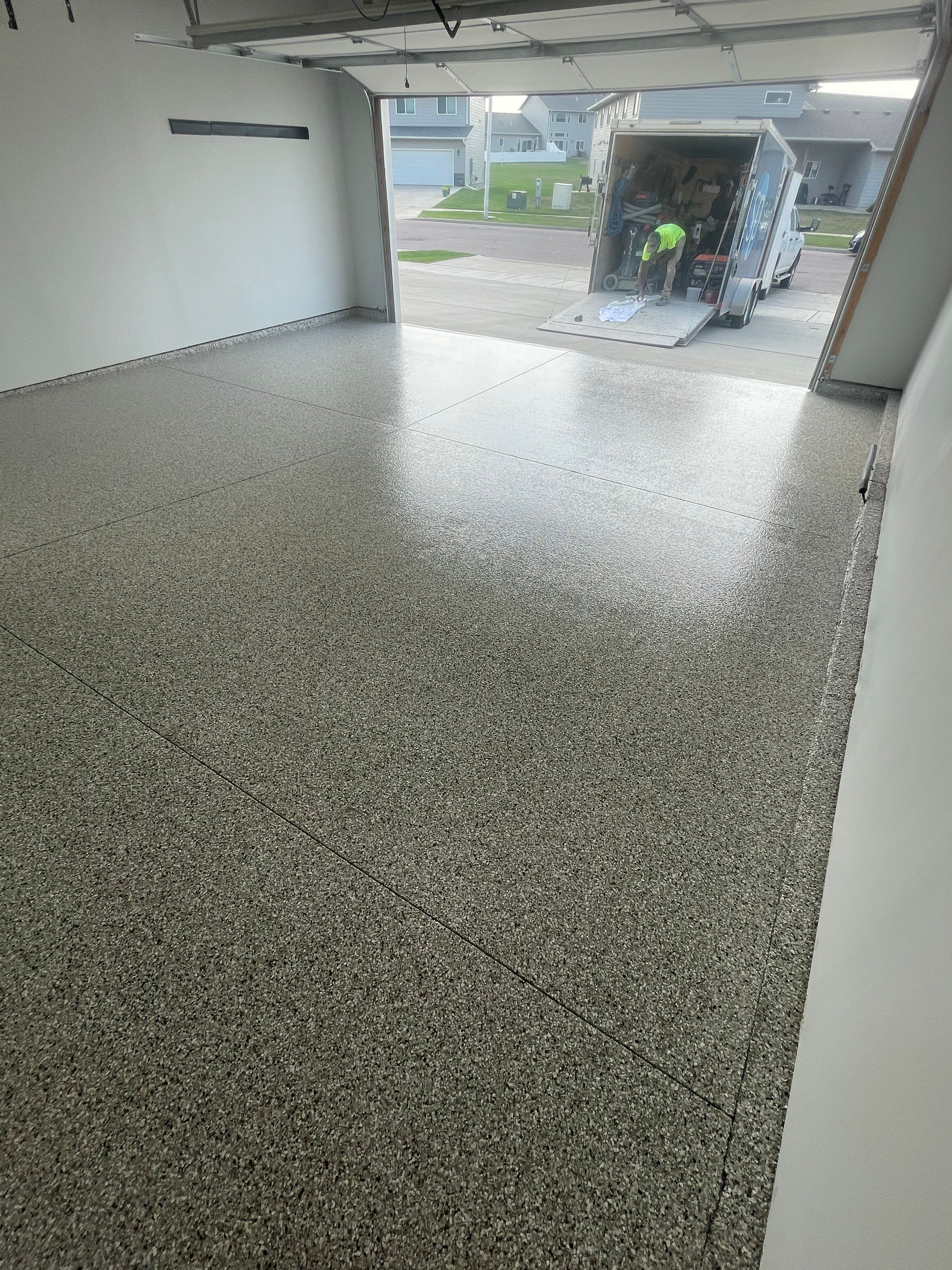 Custom Coyote Flake Garage Floor Coating in Sioux Falls by Select Painting, Coatings & Garage Cabinets