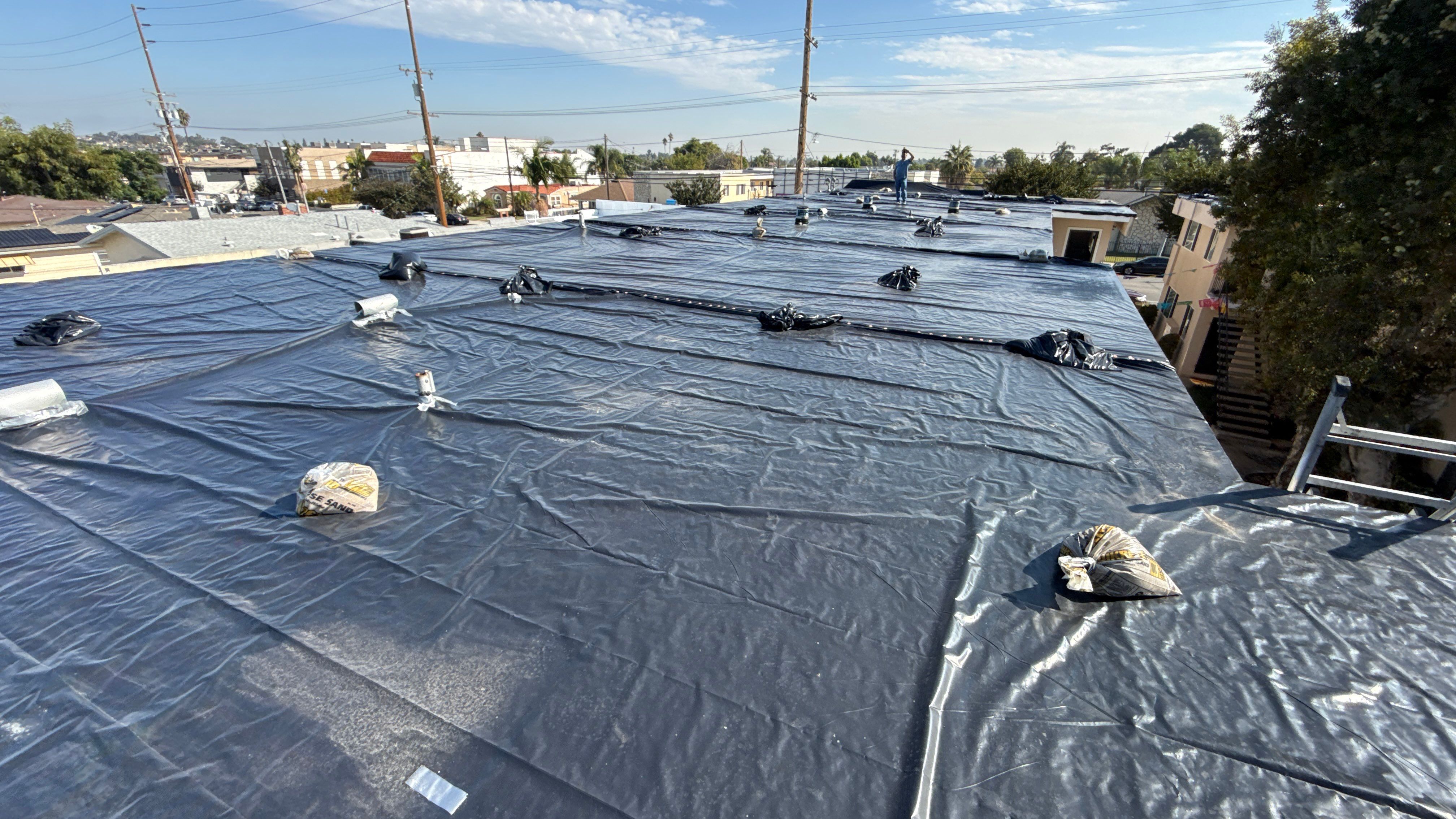 Silicone Membrane installation in LOMITA, CA. by Hull Brothers Roofing