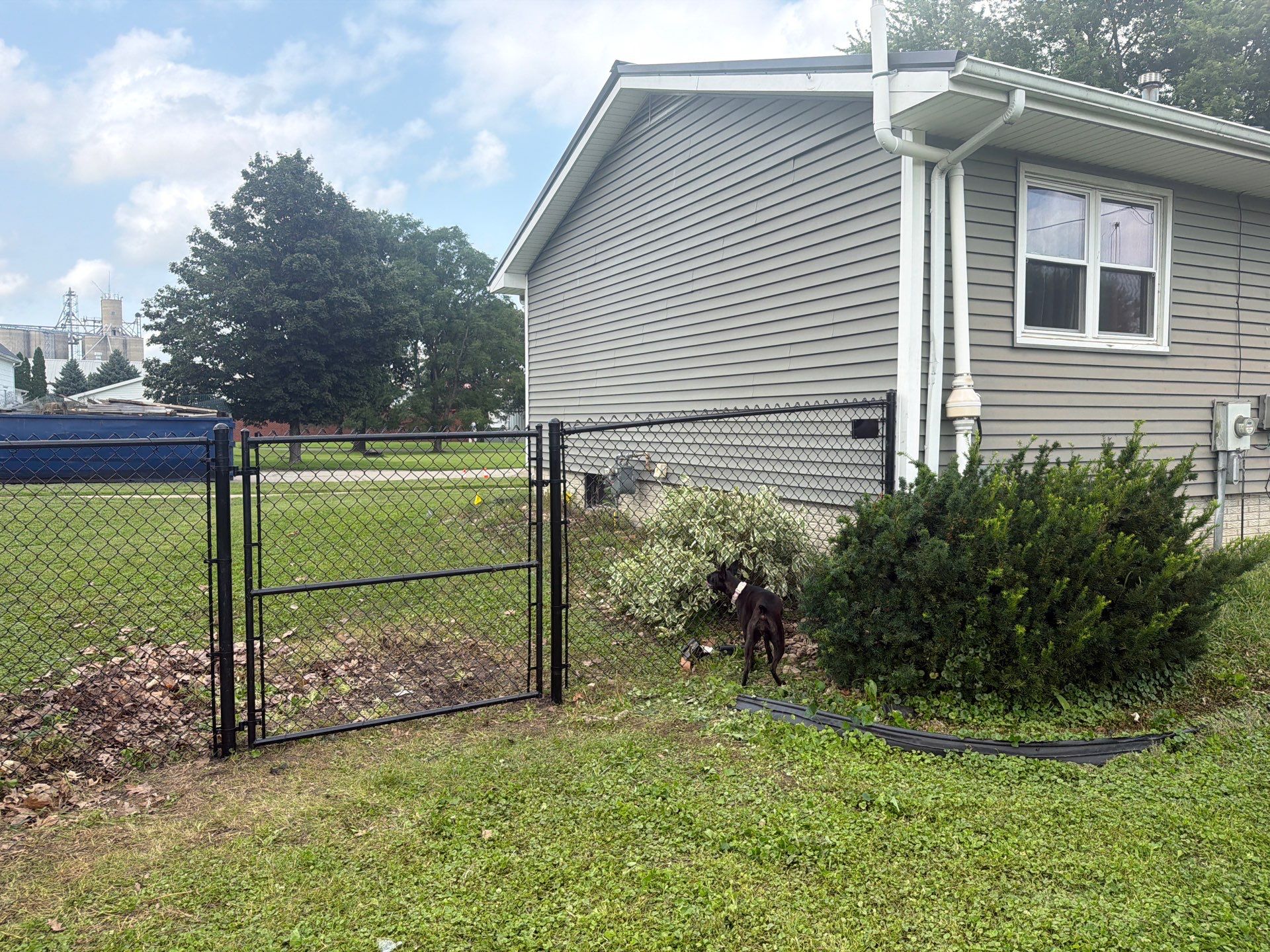 Residential Black Chain Link Fence Installation in Reinbeck by Perfect Picket Fence and Stain