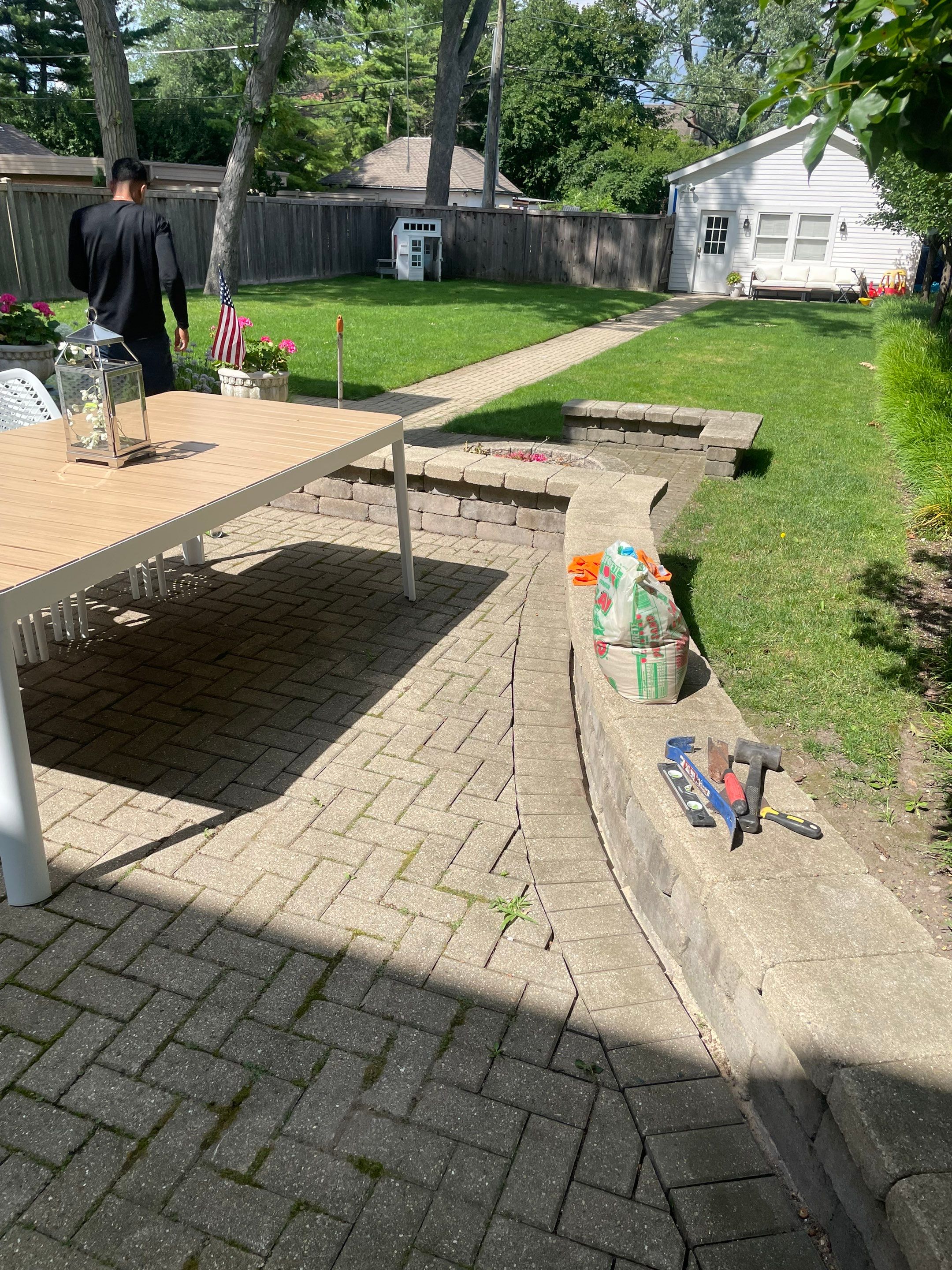 Brick patio repair, clean sand and seal by Northern Power Washing LLC.