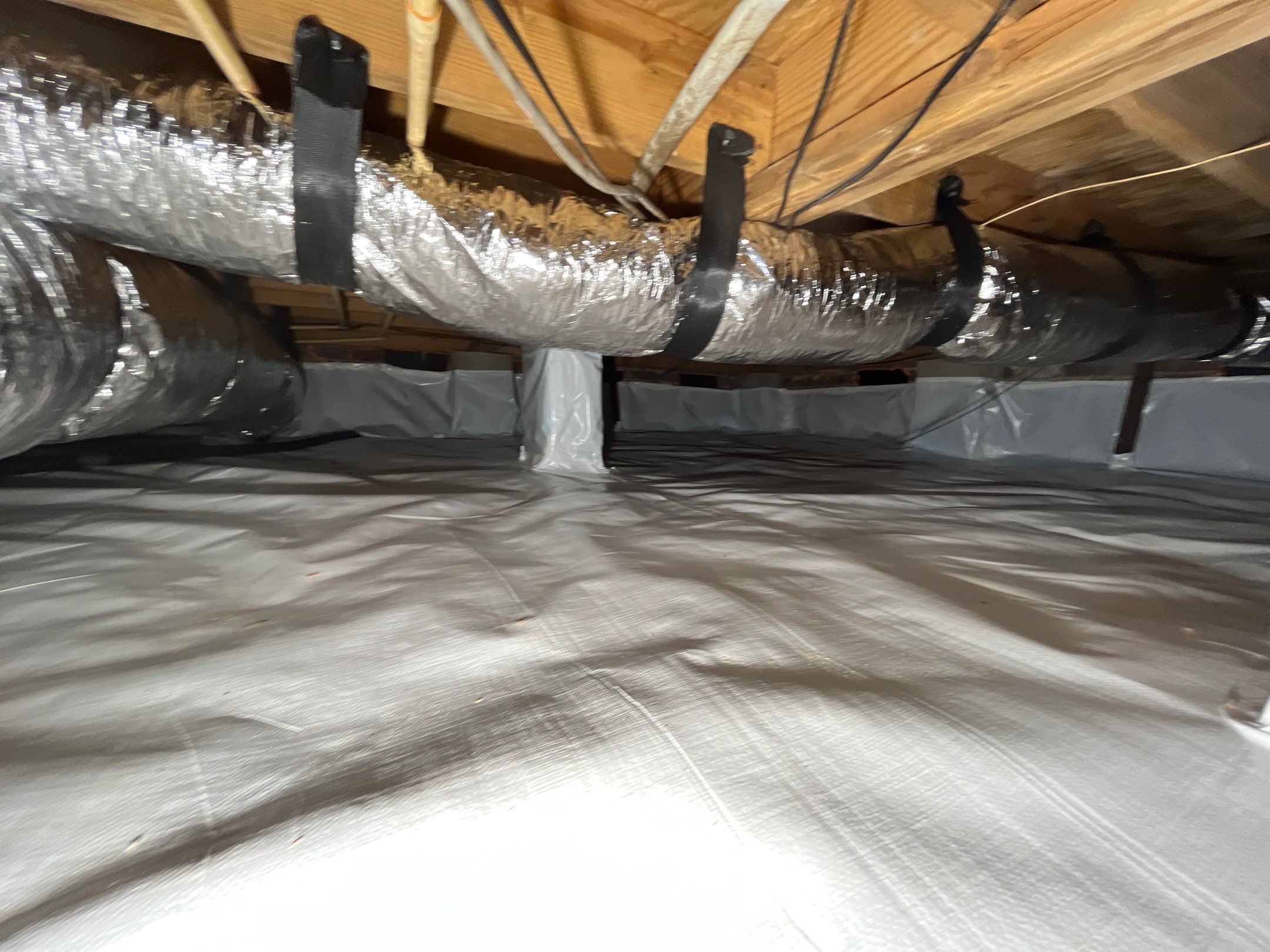 Crawlspace remediation & encapsulation with ductwork replacement by EAS Environmental, LLC.