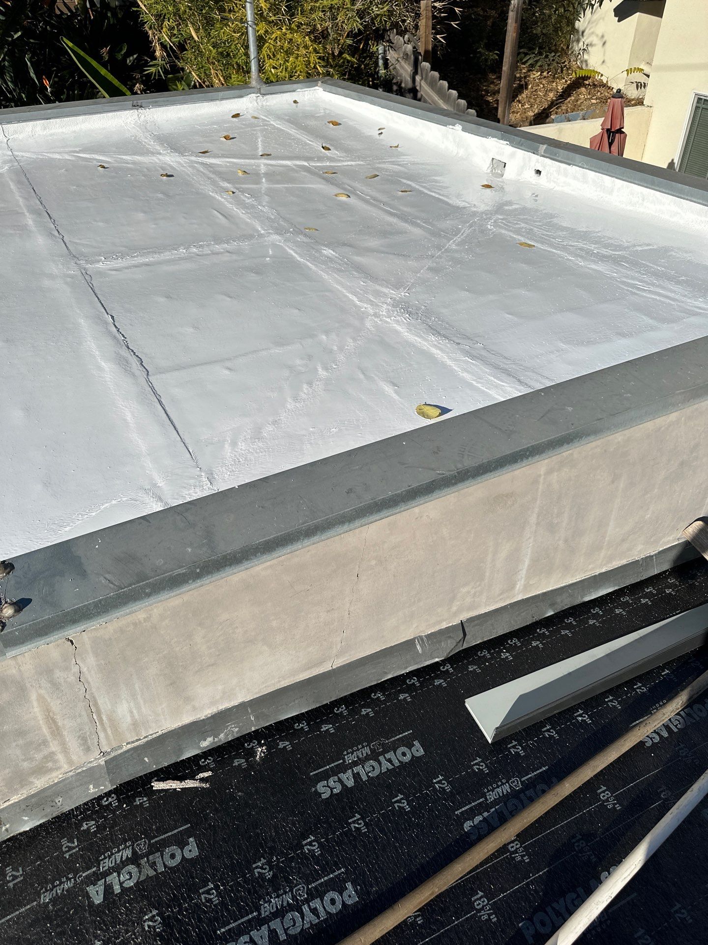 Residential Roofing Installation using Polyfresko® G Highly Reflective Modified Bitumen Cap Sheet by Hull Brothers Roofing