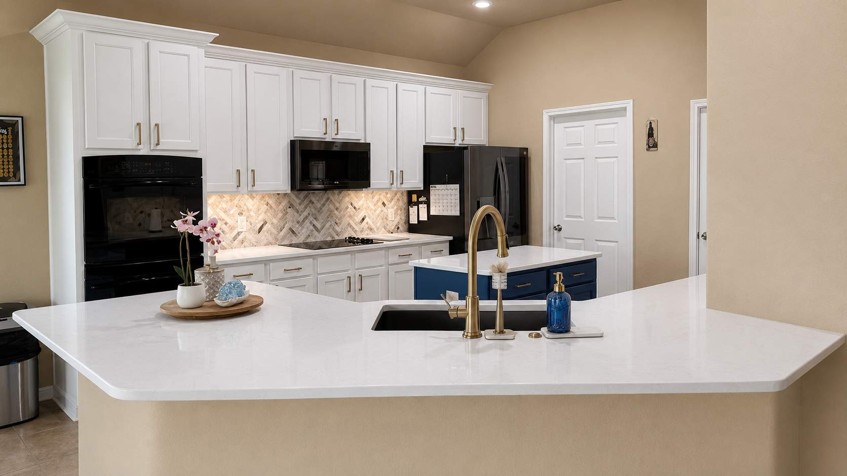 Cibolo Kitchen Refresh with Painted Cabinets, Quartz Countertops & Herringbone Backsplash by Legacy Bath and Kitchen