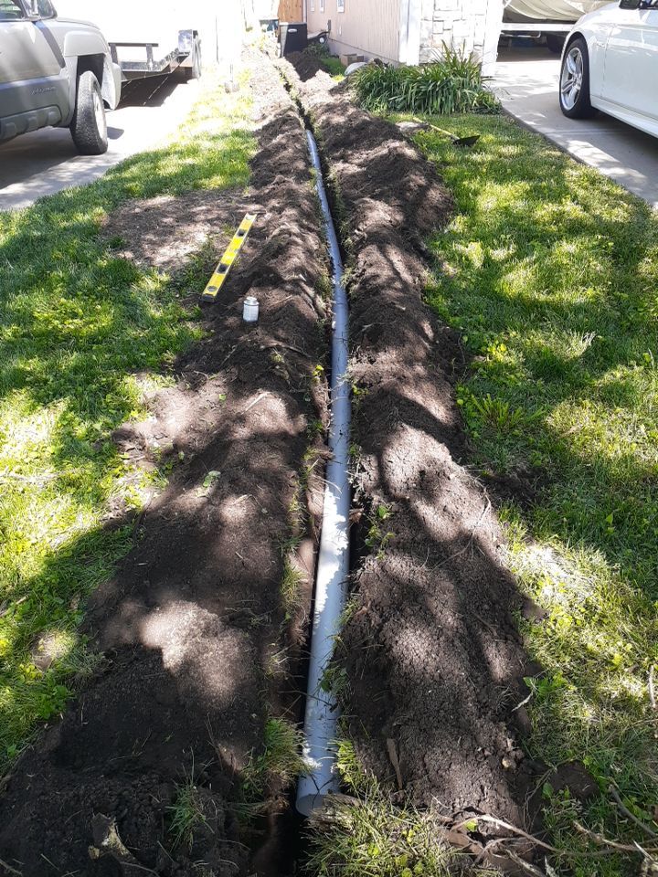 Drainage and Downspout Installation by LAND ESCAPES LLC