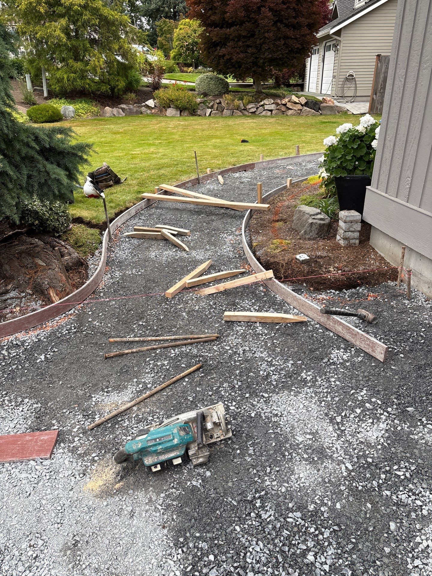 Exposed Aggregate Concrete Driveway Makeover  by Jireh Asphalt & Concrete Inc 