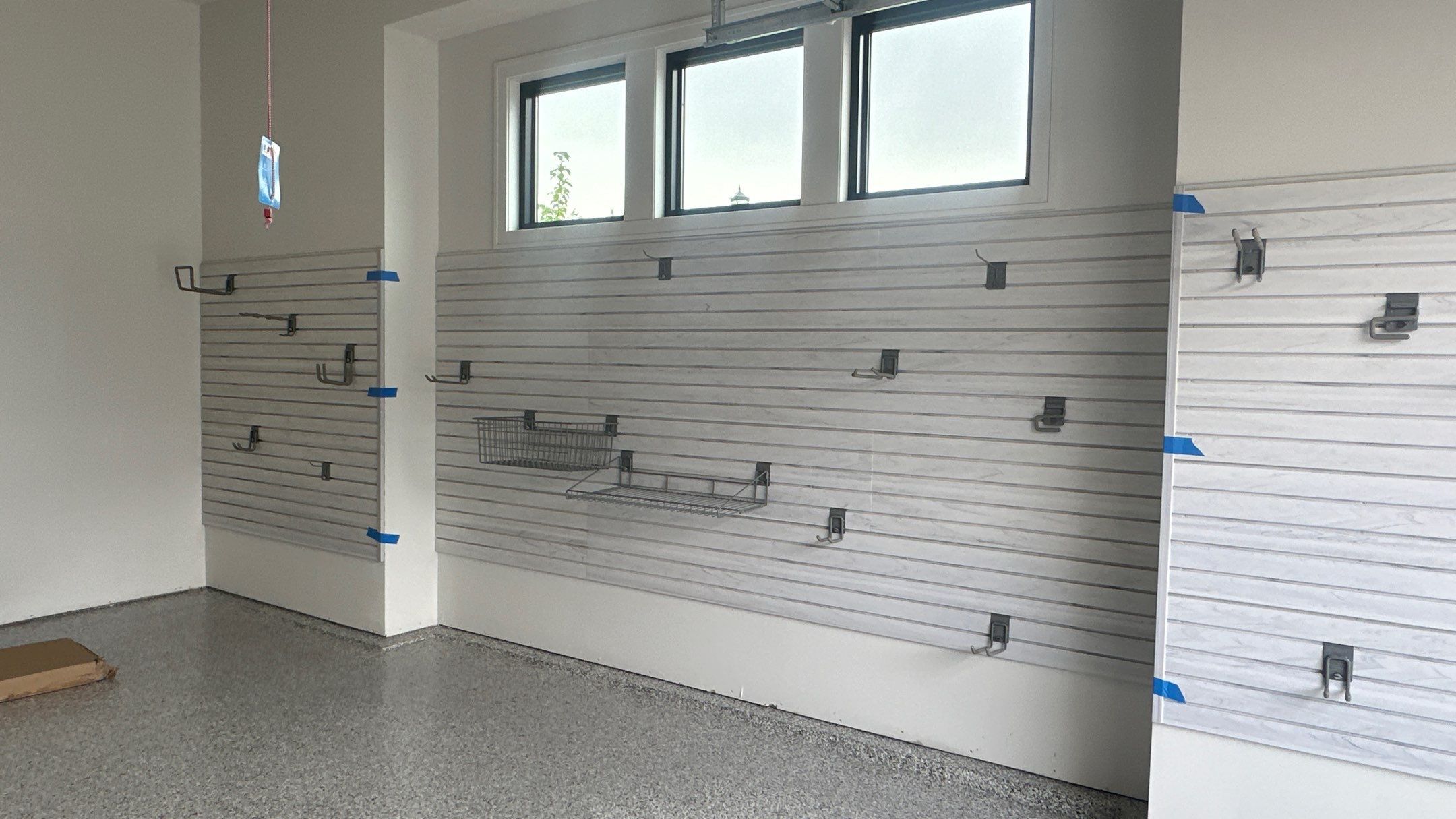 Jon S. transformed his garage with a new floor, slotwall & Cabinets! by Banner Garage