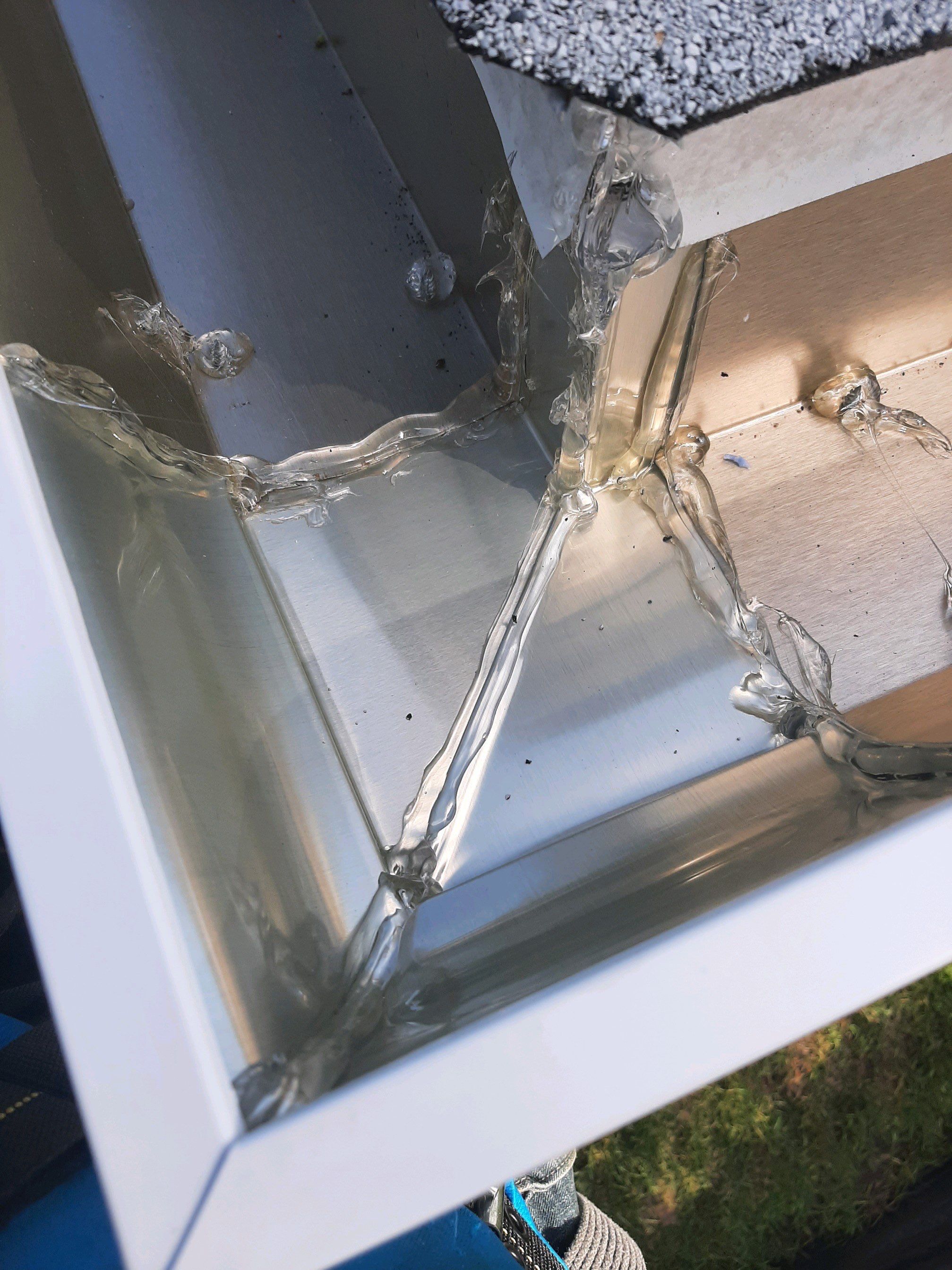 Seamless Gutter Installation using White by Gutter Professors