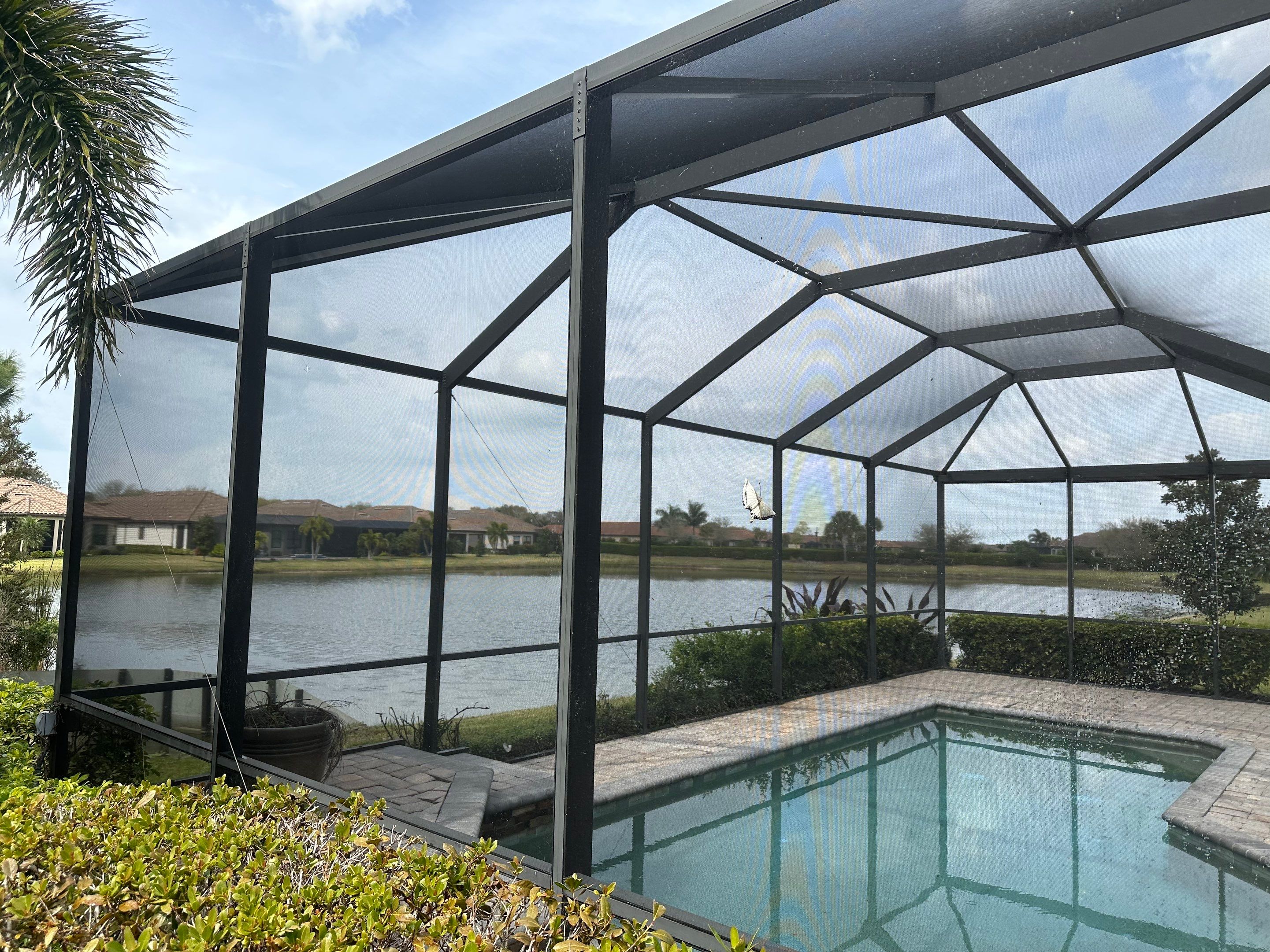 Concrete Tile Roof, Paver Pool Deck, Screen Enclosure & Driveway Cleaning in Artisan Lakes Esplanade, Palmetto, FL | Sunshine AquaWash by Sunshine AquaWash