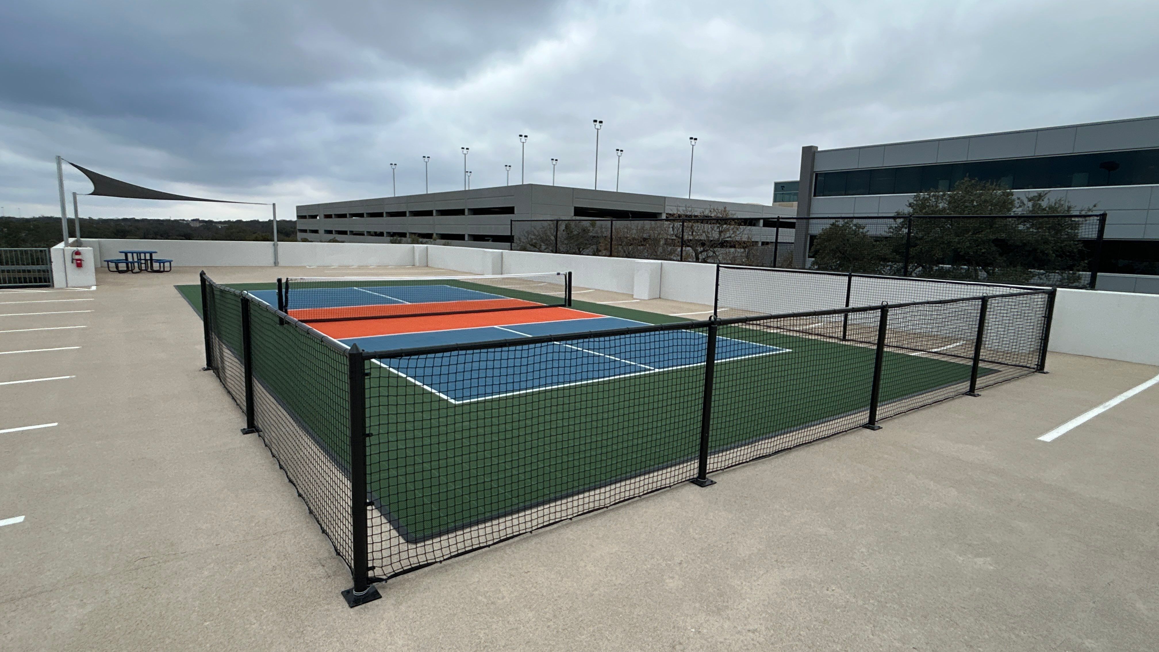 Travis Oaks Parking Garage by Sport Court Austin