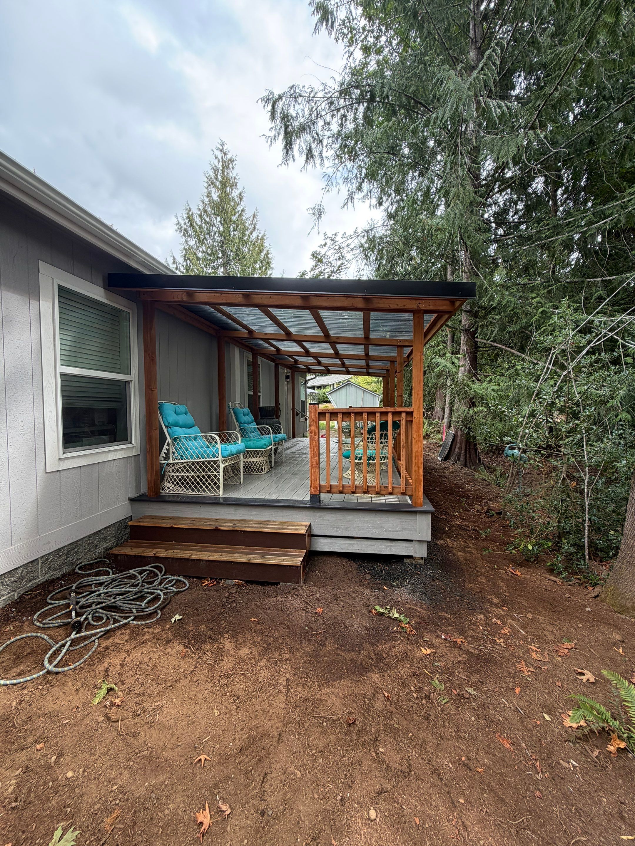 Covered Composite Deck with Translucent Pergola Roof in Port Orchard by Expedeck