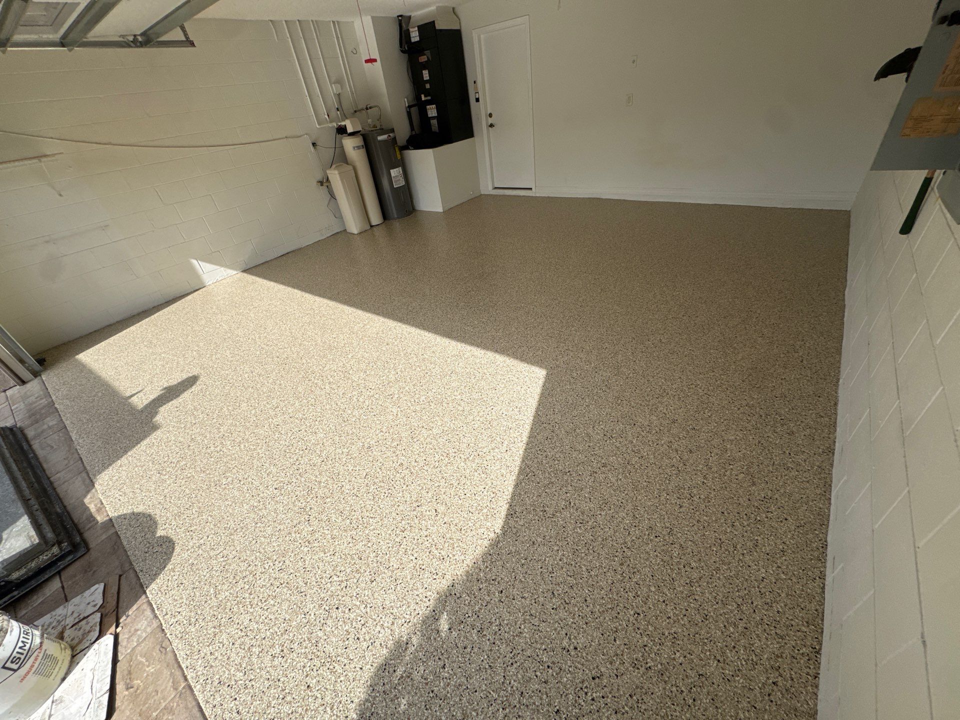 Shoreline Flake Garage with High-End Neutral Tones by Performance Floors & Coating