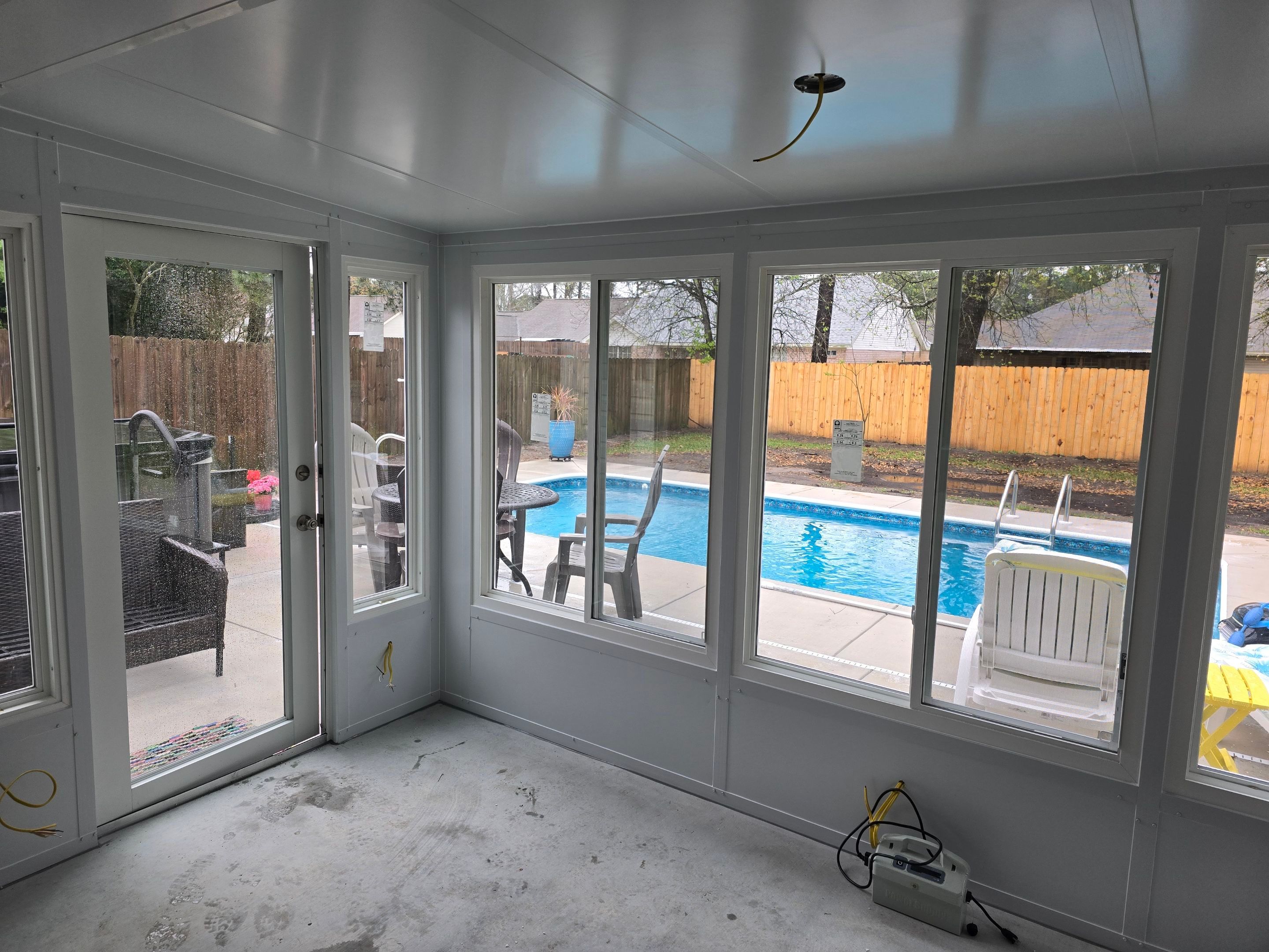 Poolside Glass Room in Gulf Breeze by Titan Sunrooms