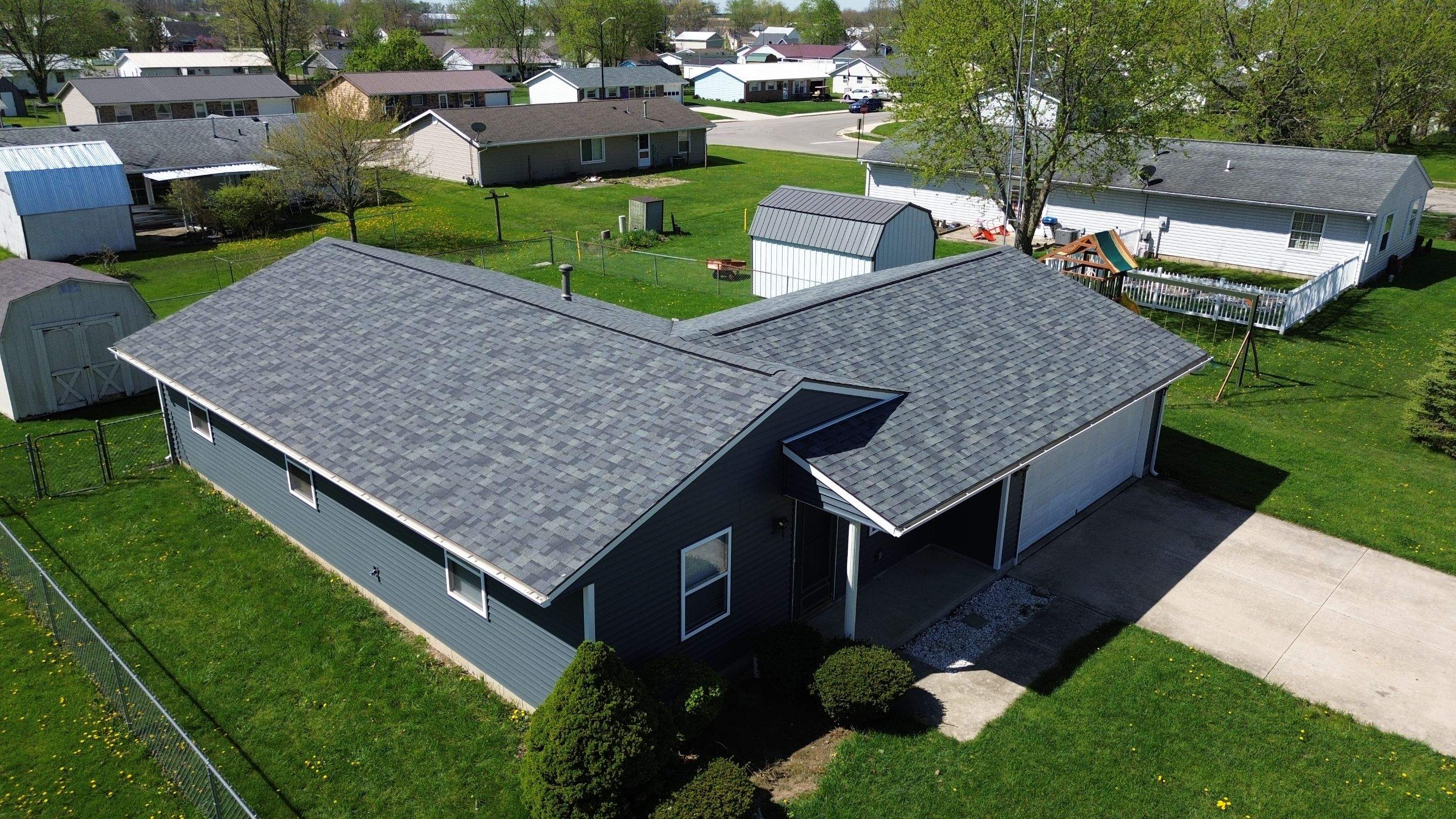 Storm Damage Residential Roof and Siding Installation by WIW Enterprises Inc