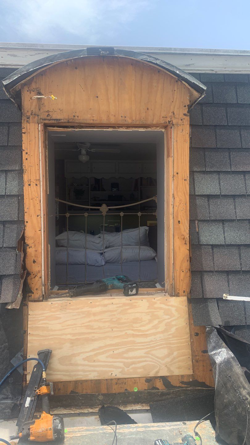 Mansard Charm by Bayfront Roofing and Construction