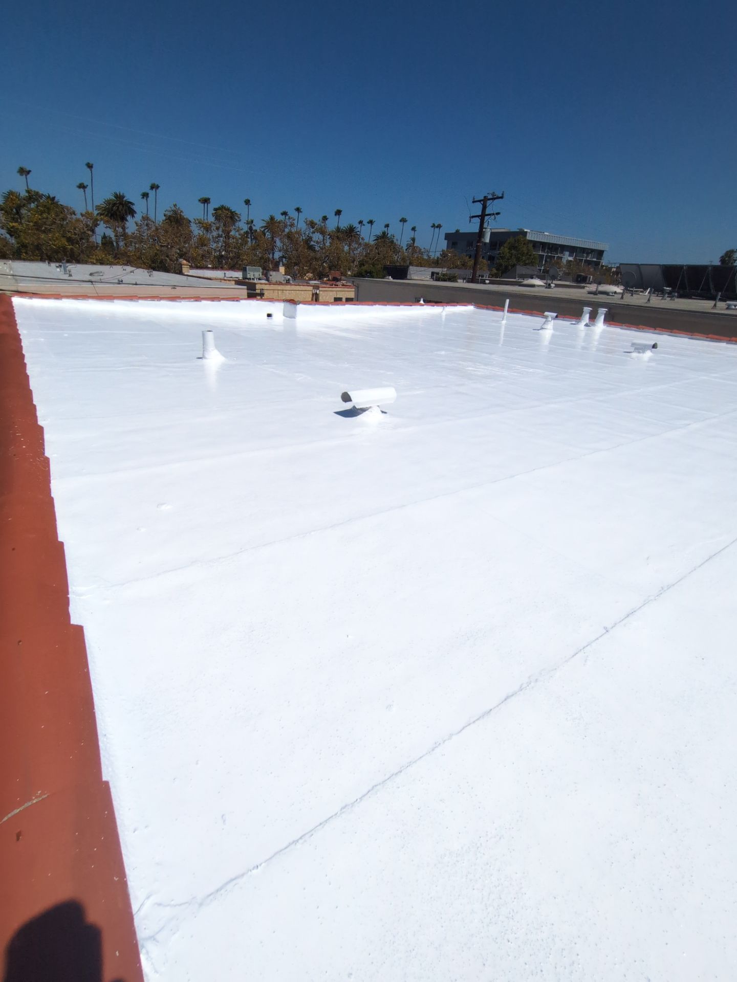 Beverly Hills Flat Roof Coating and Terracotta Tile Reset by Hull Brothers Roofing