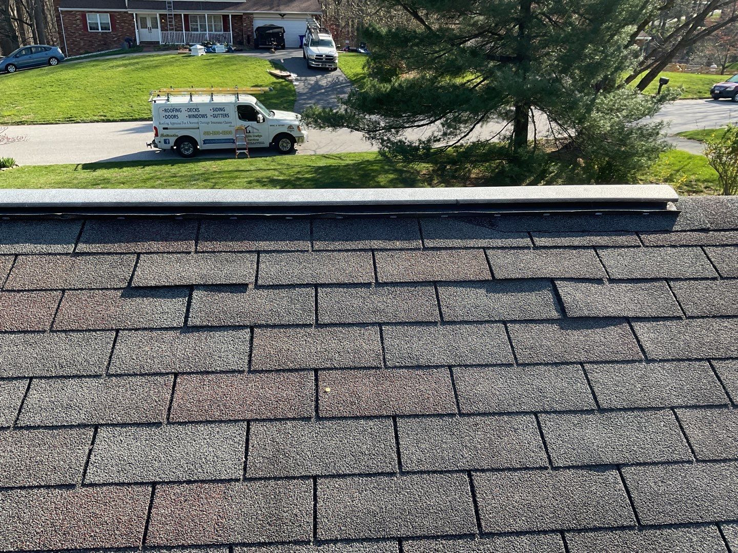 Residential Roofing Installation using Landmark Shingles Color Weatherwood by Alpha Design Services