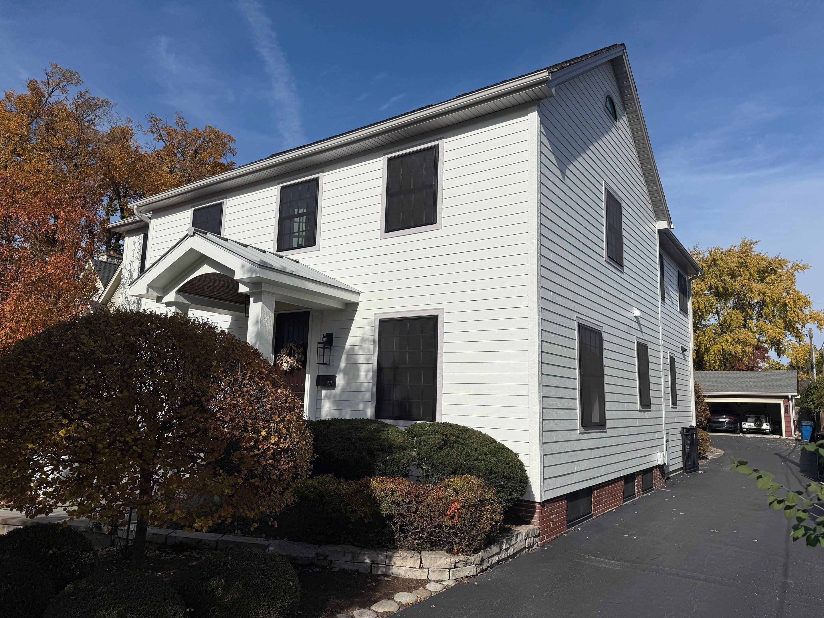 Exterior Renovation in Elmhurst with James Hardie Siding and Windows by Great American Exteriors