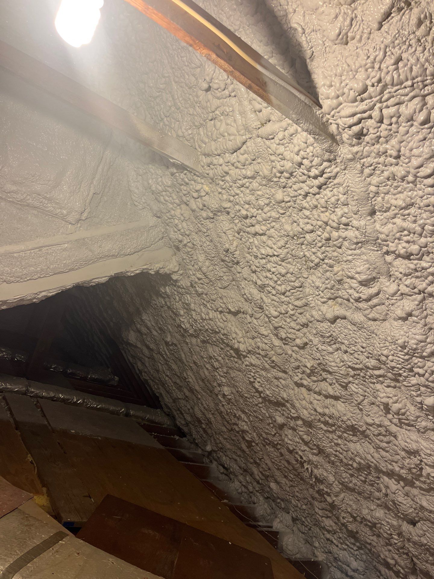Attic Retrofit using open cell spray foam by NYS Foam & Energy