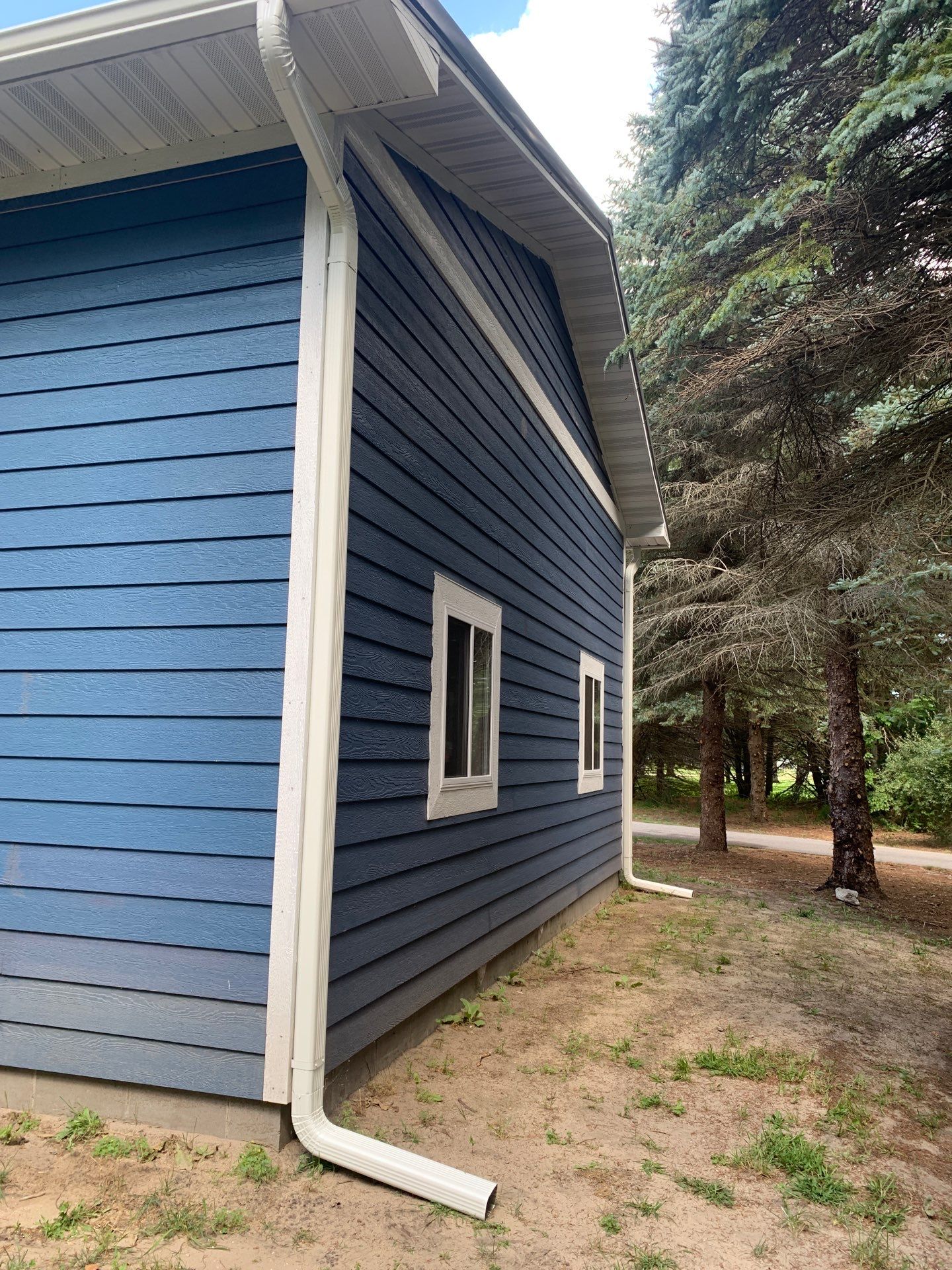 Gutter and Gutter Helmet Installation for Lake Leelanau Home by Rainbow Seamless Systems