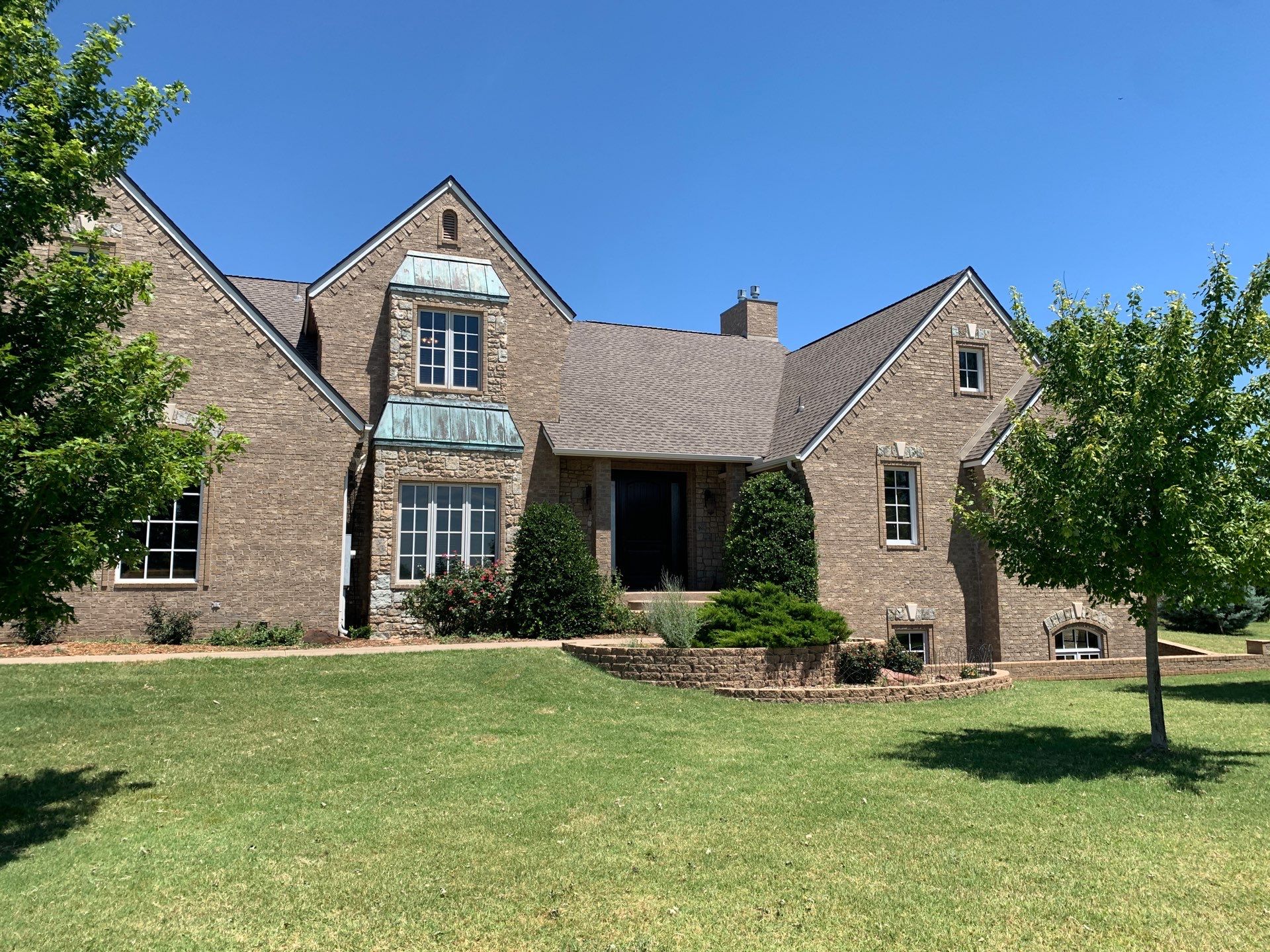 Roof Replacement and Gutter Installation in Edmond, OK by McCann's Roofing and Construction