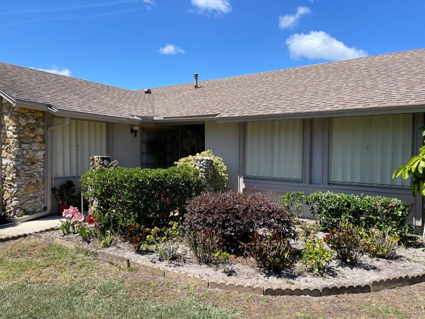 Ivory accordion shutters by Smart Guard Shutters