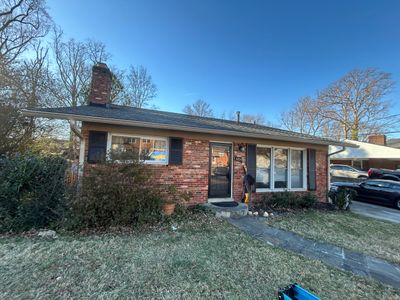 Fairfax: Residential Siding Replacement with CertainTeed 8" Board and Batten Siding in Desert Tan