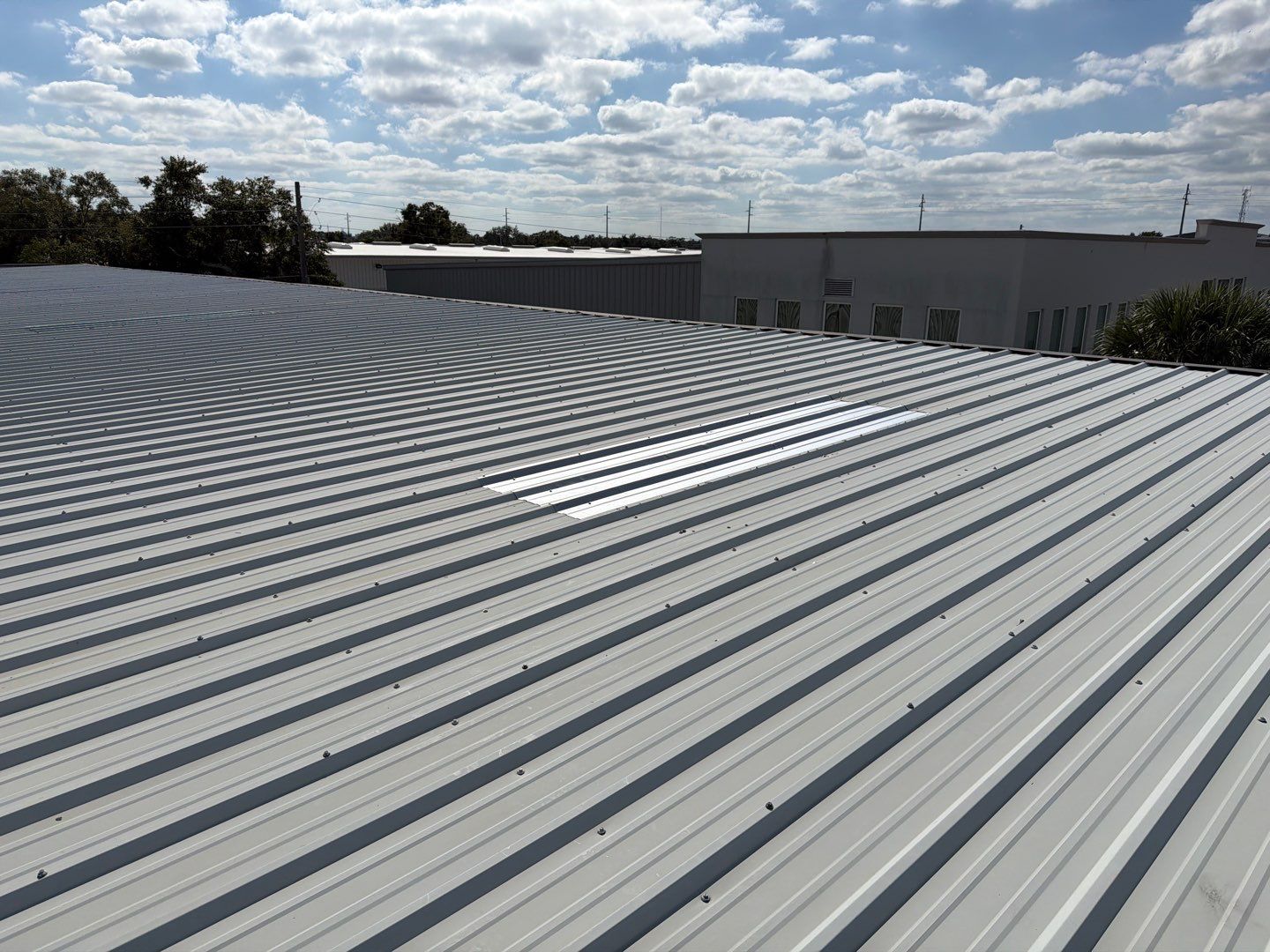 Orlando Commercial Metal Roof Restoration and Silicone Coating System by CES Roofing