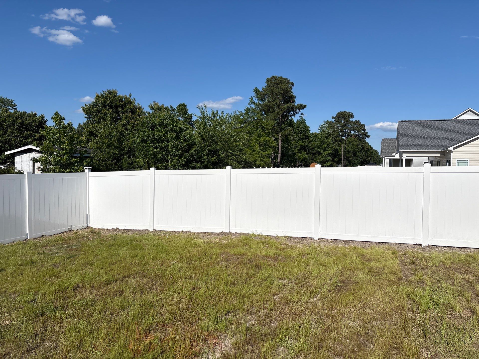 White Hamilton Vinyl Privacy Fence and Double Gate Installation in Greenville by Superior Fence and Rail