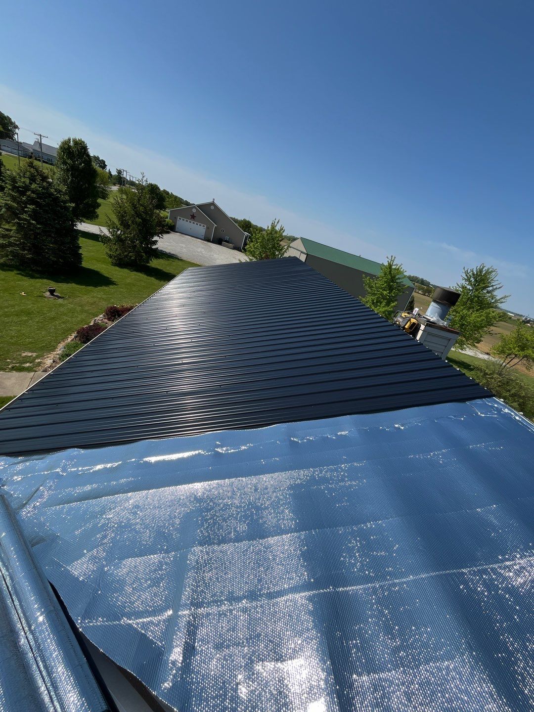 Residential Roofing Installation using Perfromance Panel Metal - Black by RoofX 