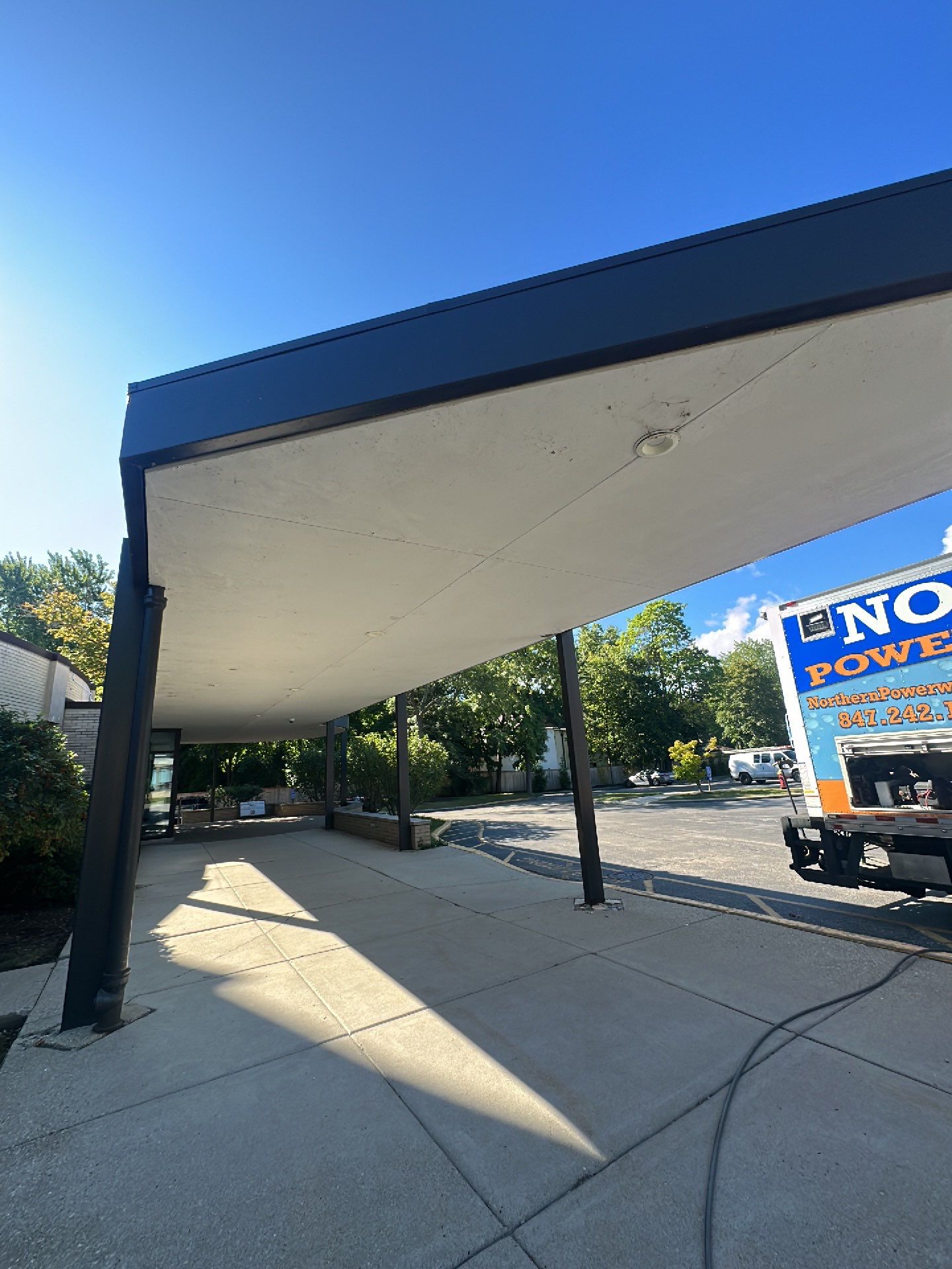 commercial pressure washing using Algaecide, soft wash soap by Northern Power Washing LLC.