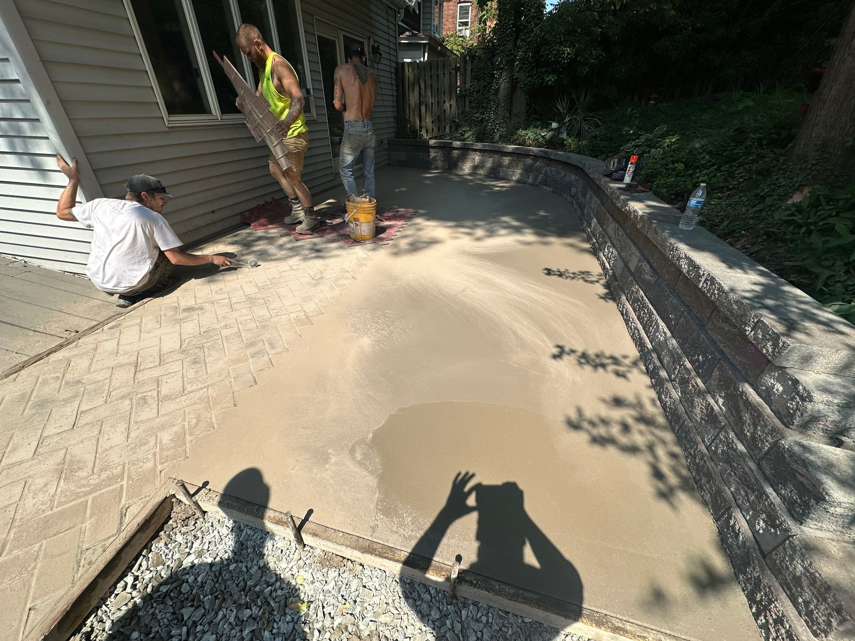 Stamped Concrete and Retaining Wall by Cousins Roofing Siding & Decks