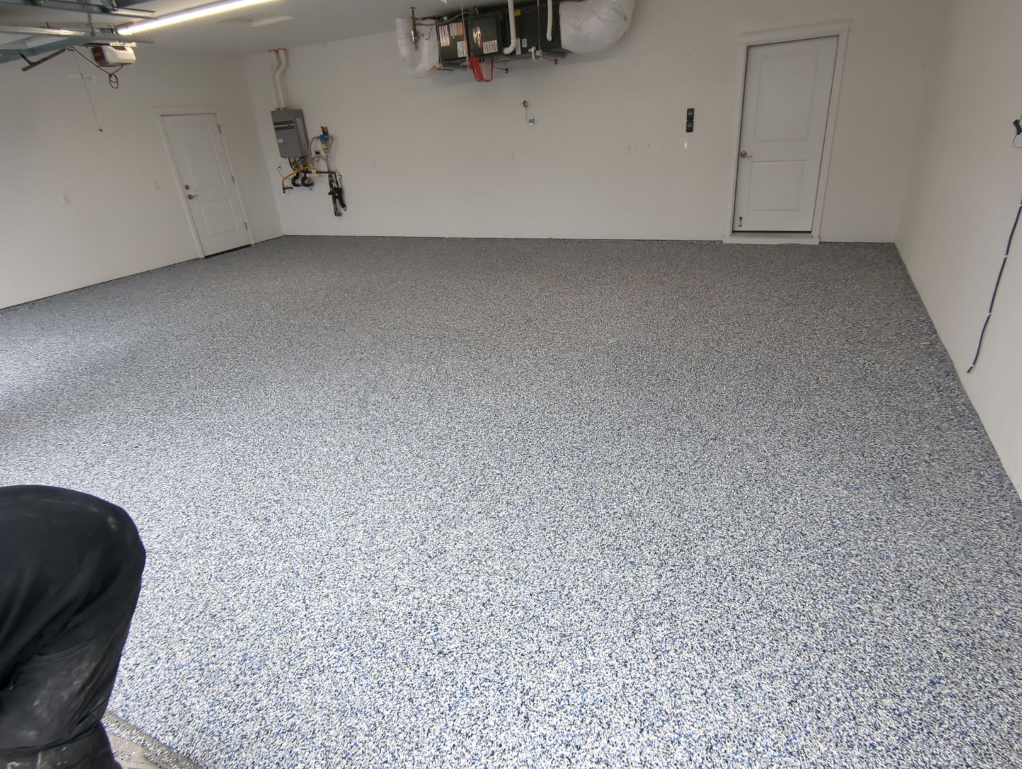 Garage Transformation using Domino with Blue by Croc Coatings, LLC