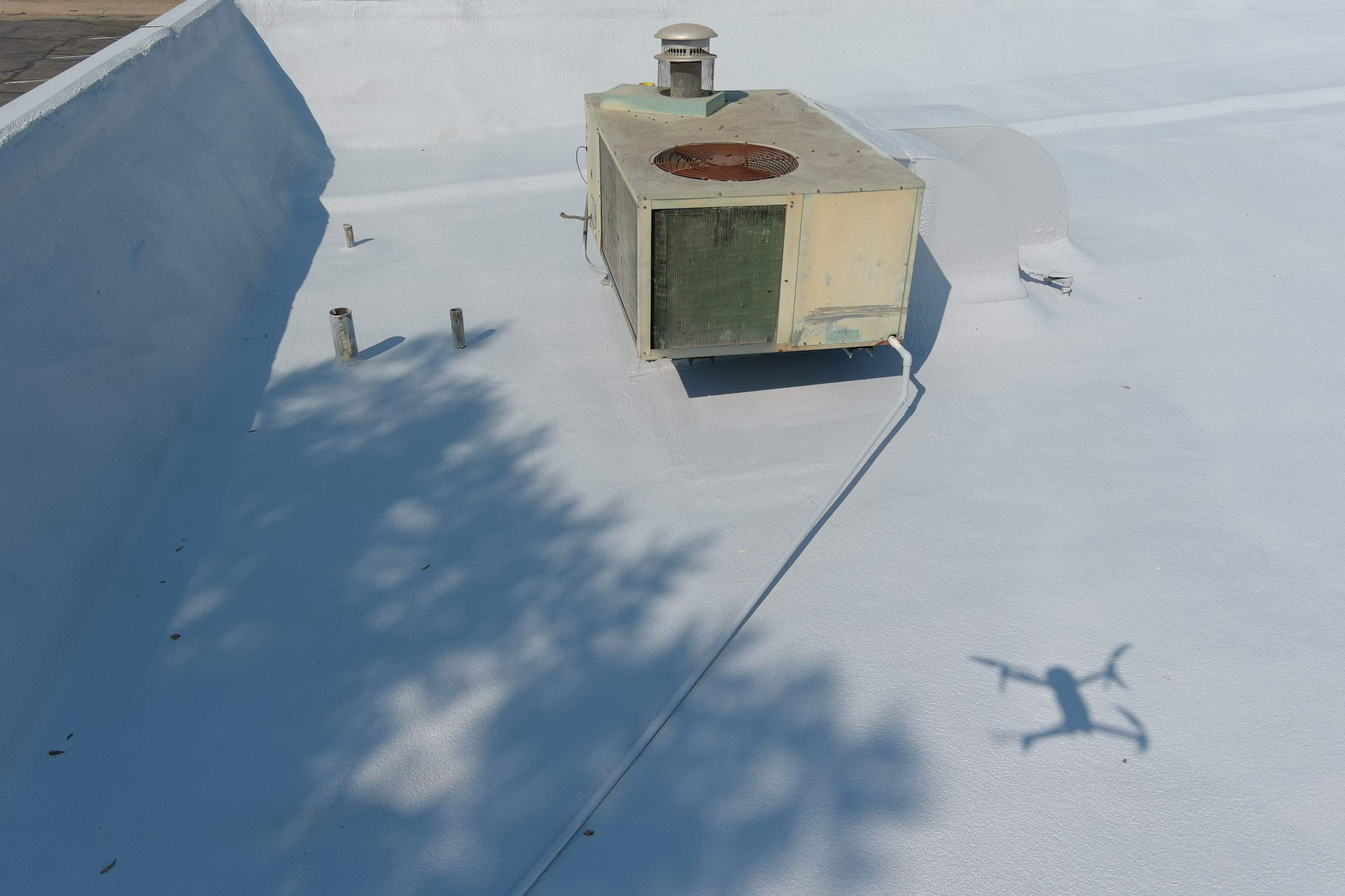 Commercial Roofing Installation using General Coatings acrylic coatings and spray foam by Straight Edge Roofing Inc