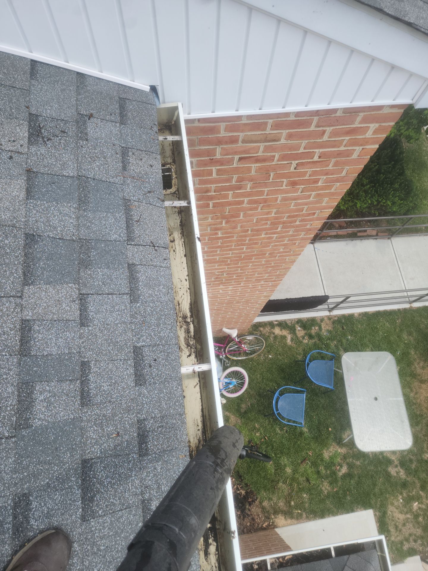 HOA gutter cleaning in Pinehurst & Southern Pines, NC, after  photo showing full gutters.