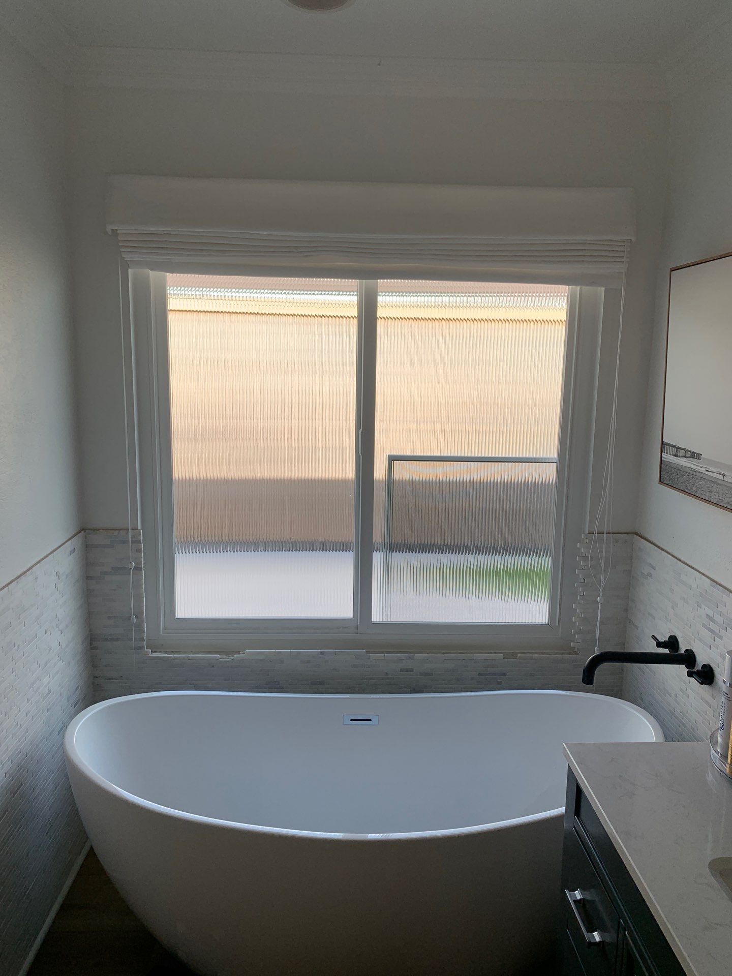 Window Installation using Milgard black vinyl windows by American Window Company