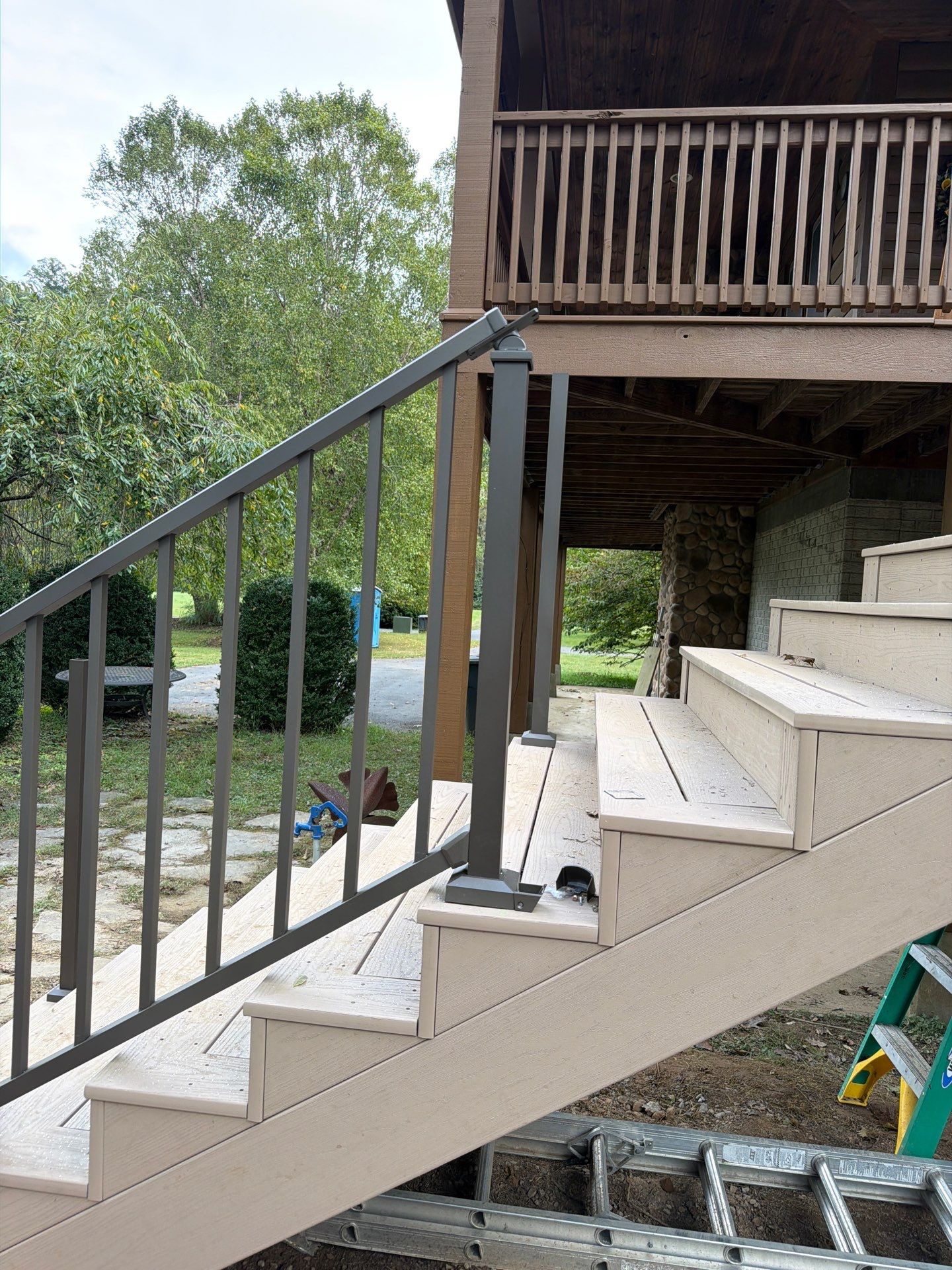 Log Cabin Wrap-Around Deck and External Staircase Installation in Caldwell by Walnut Hollow Decks & Outdoor Living