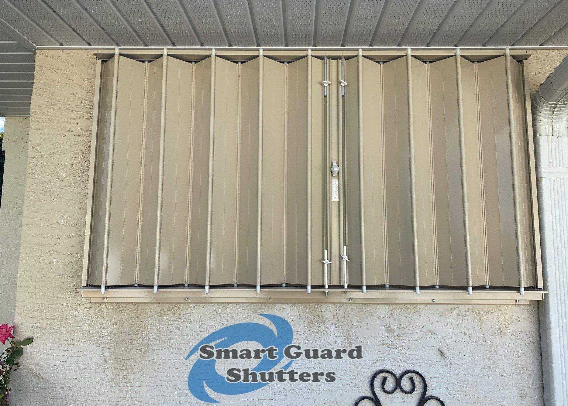 Accordion Shutters in Beige by Smart Guard Shutters