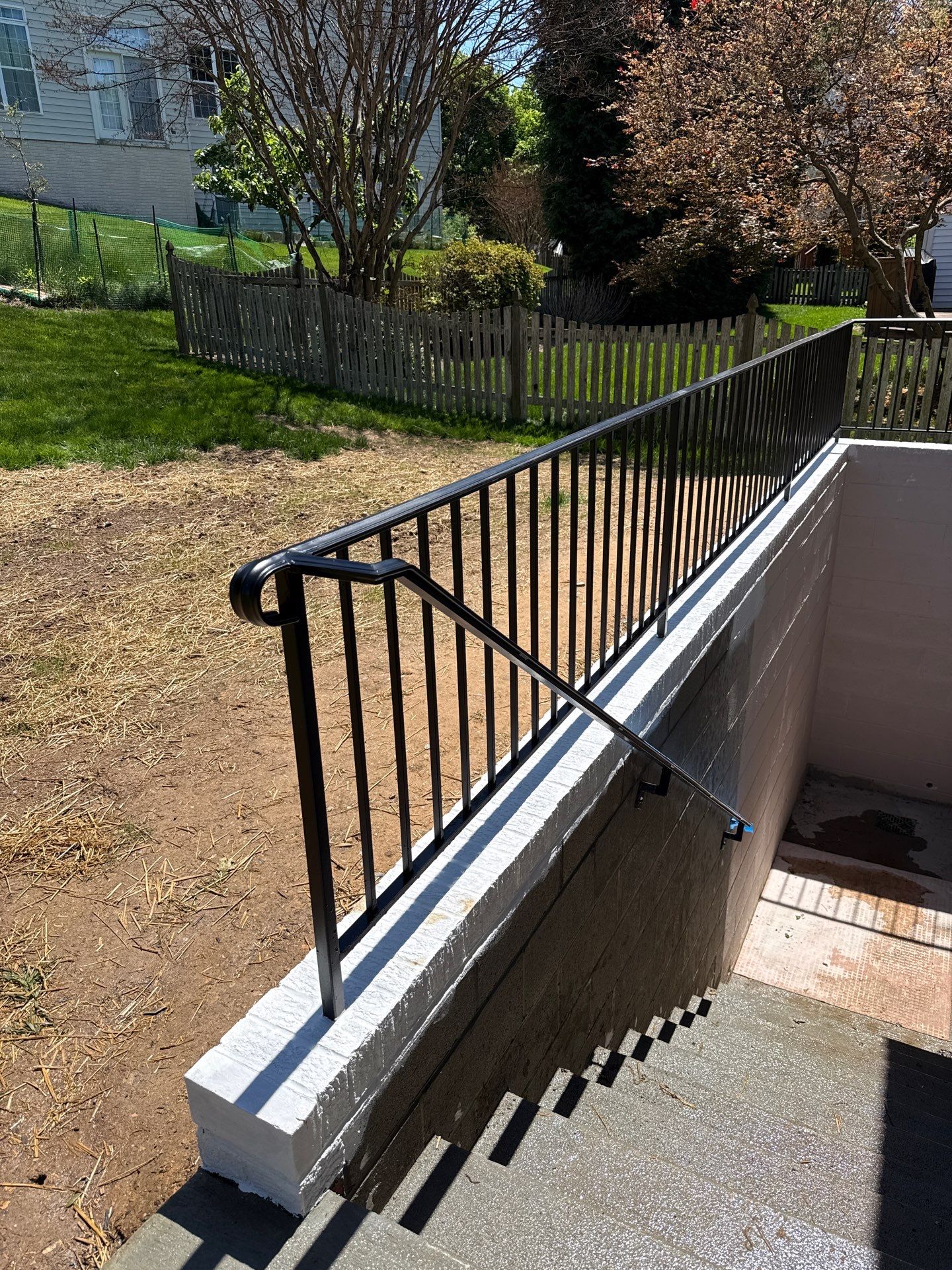 Basement Stairwell and Window Well Railing Installation in Germantown by Capitol Iron Works