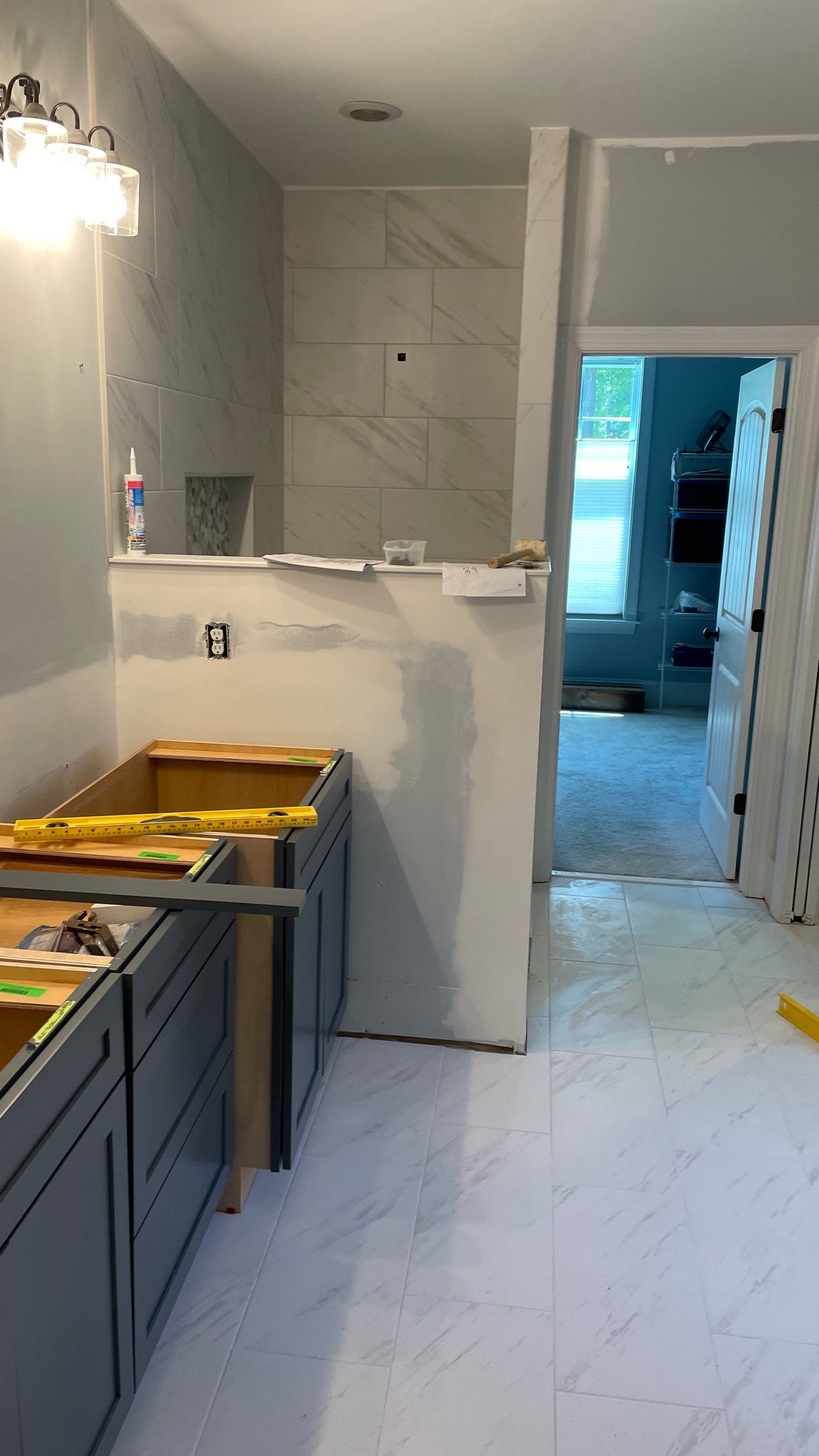 Bright Bathroom Remodel with Wall Removal, Stand Alone Tub and New Vanity by Footprints Floors of Coastal Carolina