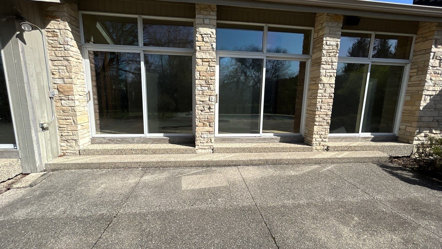 Aggregate Clean and seal using low gloss sealer by Northern Power Washing LLC.