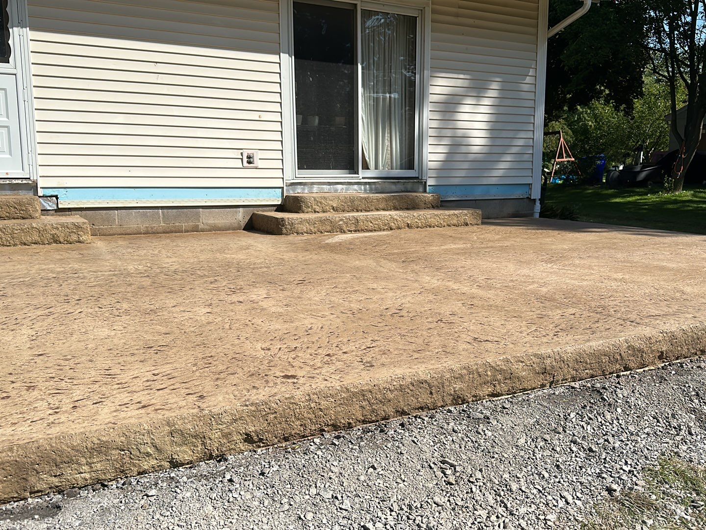 Bluestone textured stamped concrete patio by NG Masonry & Construction LLC