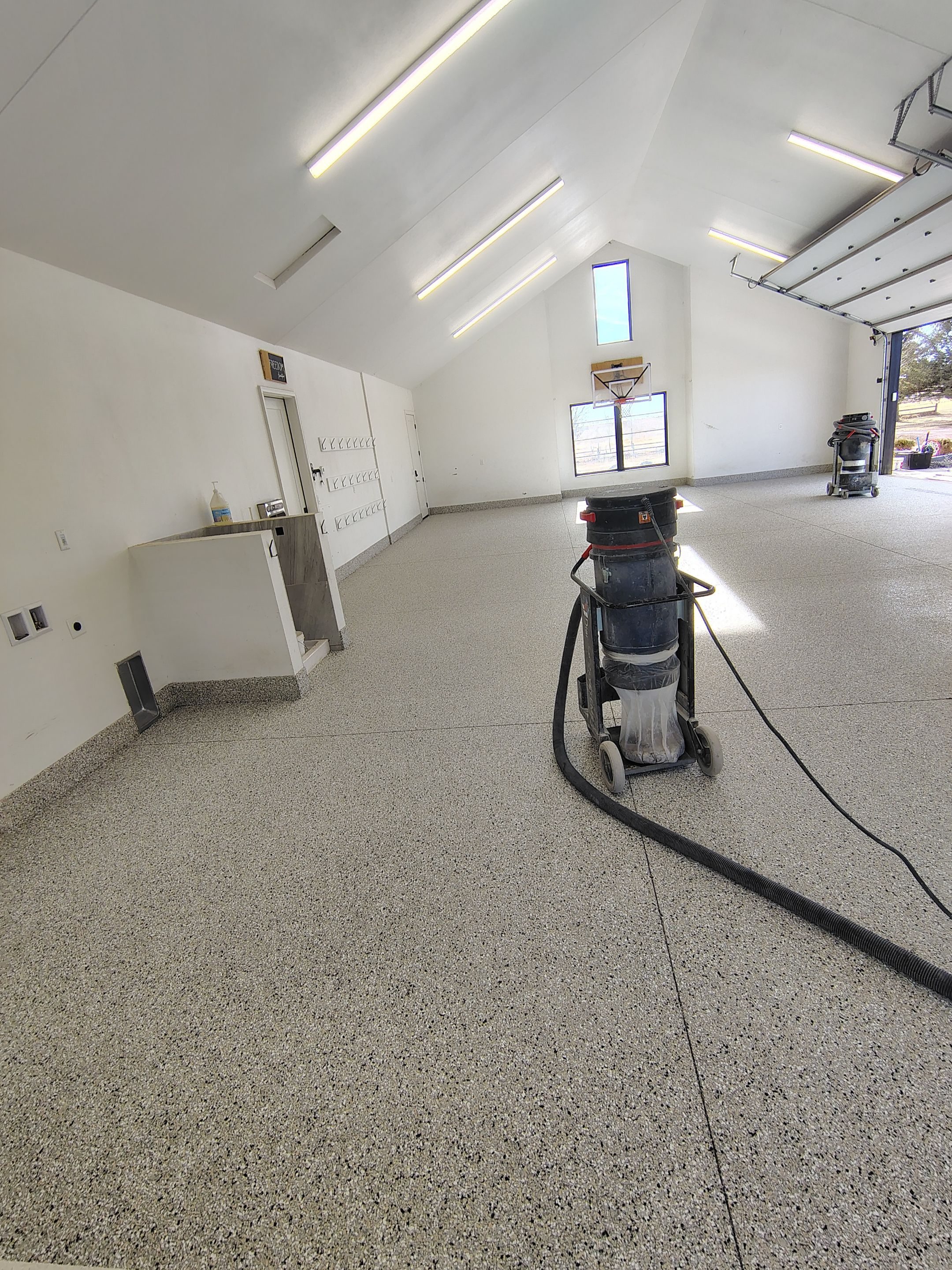 Epoxy Flake Garage Floor and Stair Coating in Sioux Falls by Select Painting, Coatings & Garage Cabinets