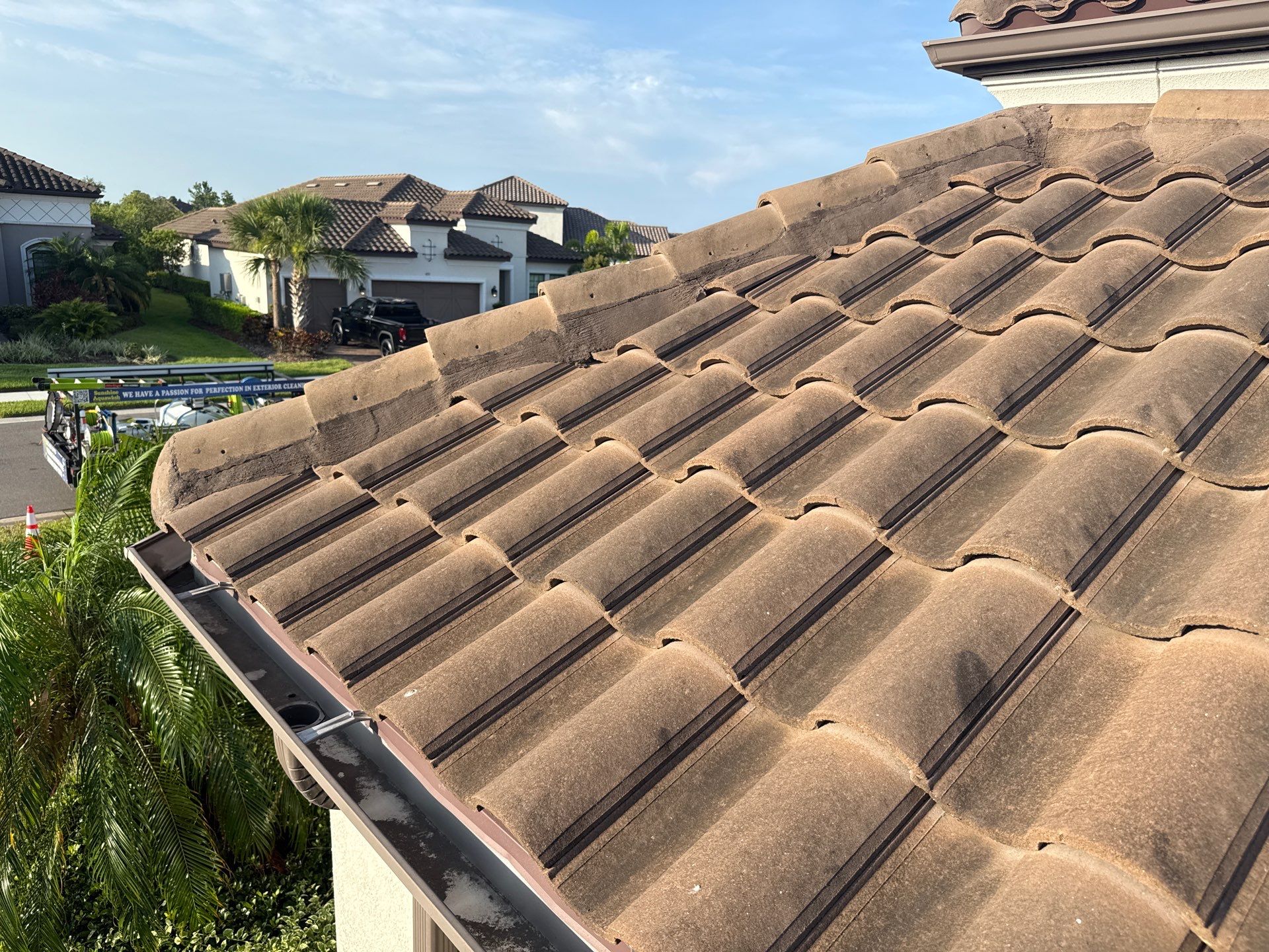 Soft Wash Roof Cleaning – Concrete Tile Roof | Artisan Lakes Esplanade, Palmetto, FL by Sunshine AquaWash