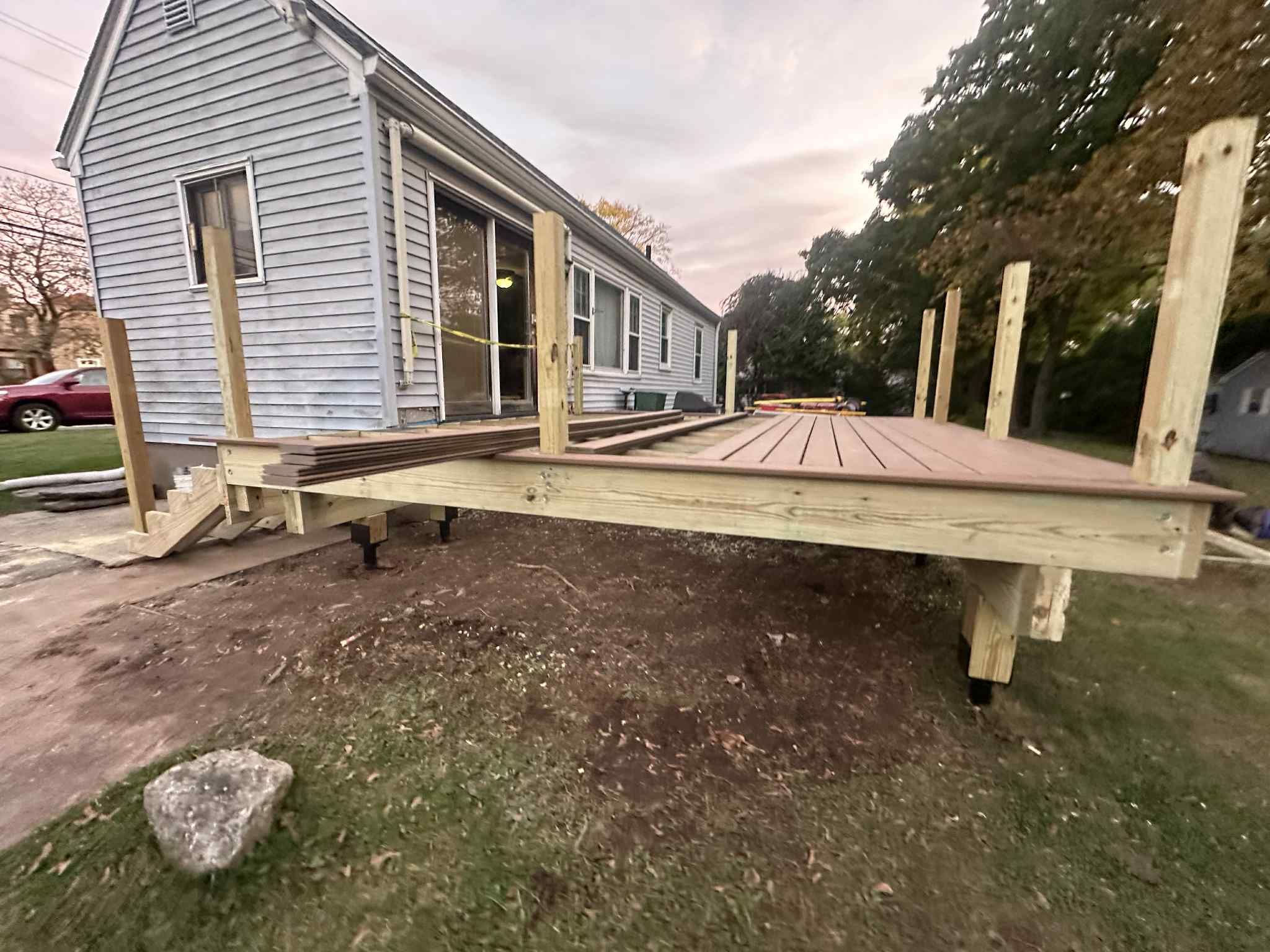 Deck Replacement with Trex Lineage Jasper, Custom Railings and Trex colored fascia by DiGiorgi Roofing and Siding Inc